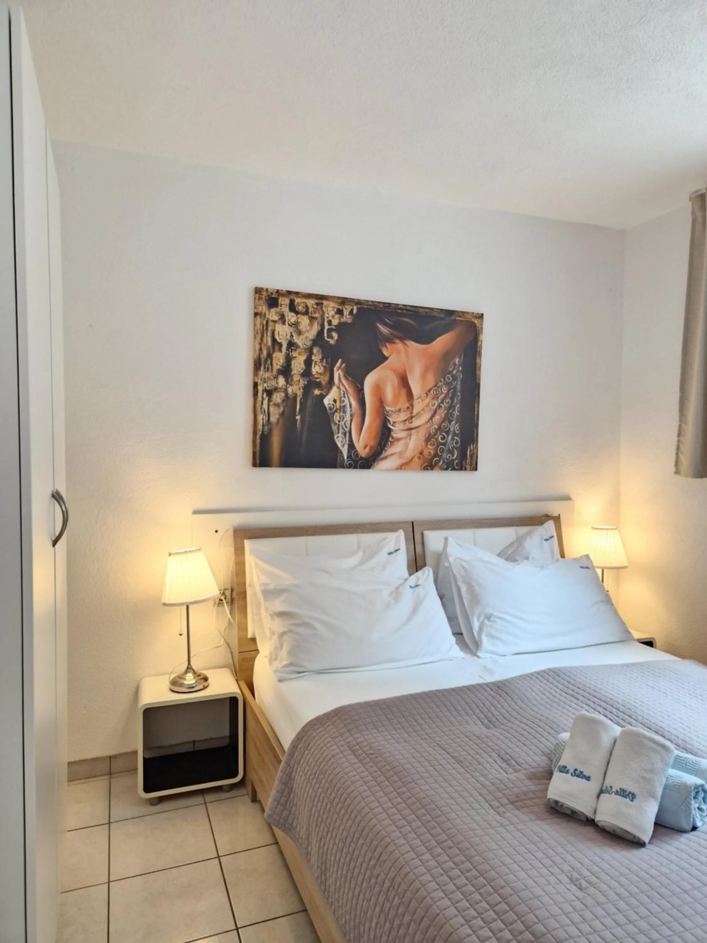 Bed in Apartments Silva with a view of sea