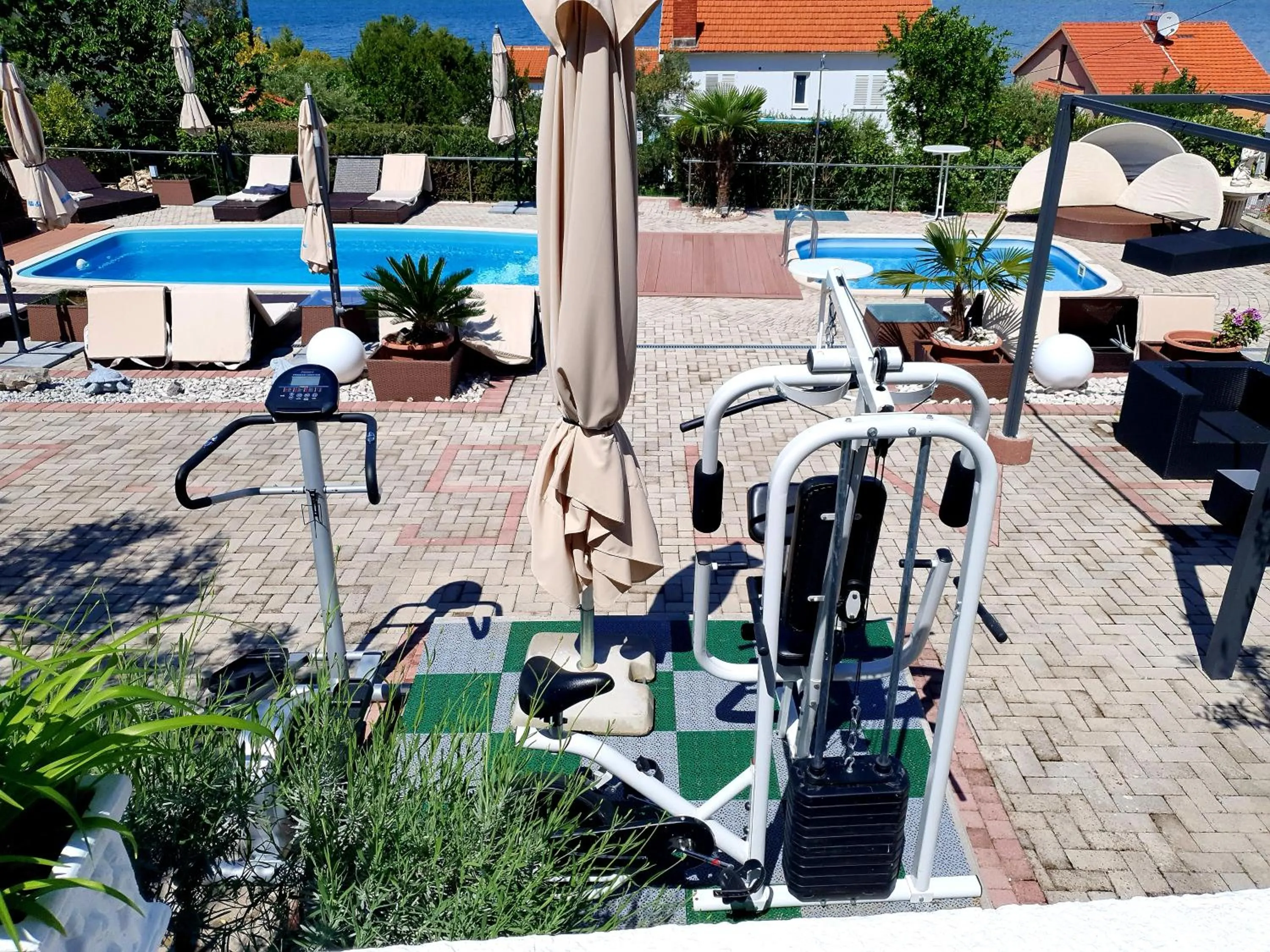 Fitness centre/facilities in Apartments Silva with a view of sea