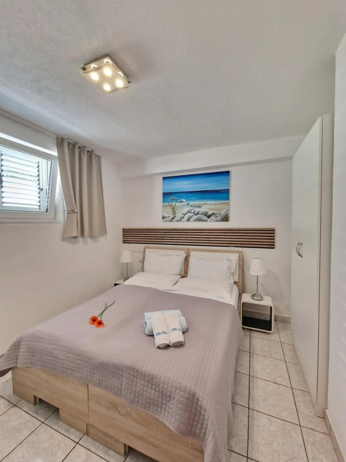 Bed in Apartments Silva with a view of sea