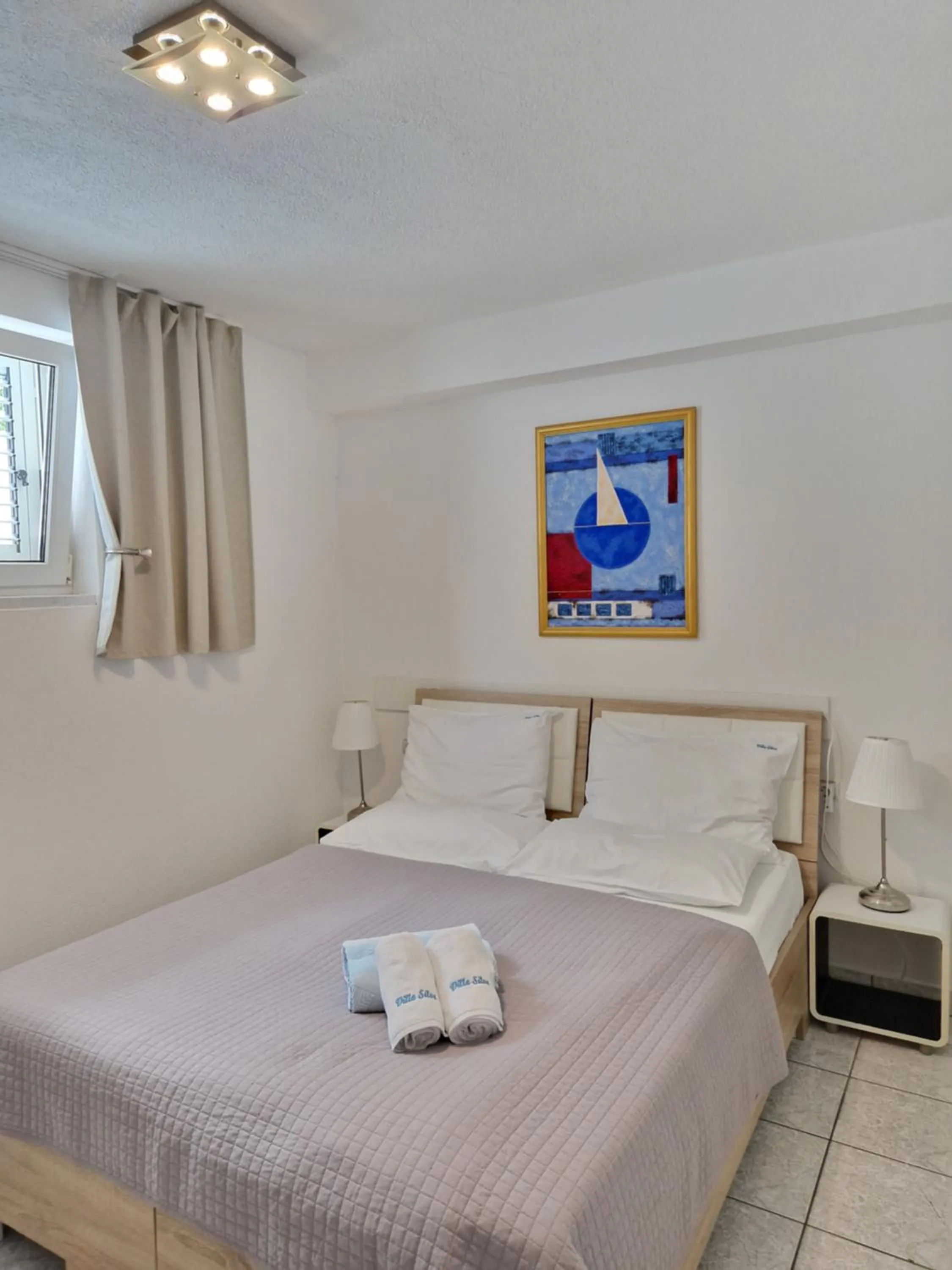 Bed in Apartments Silva with a view of sea