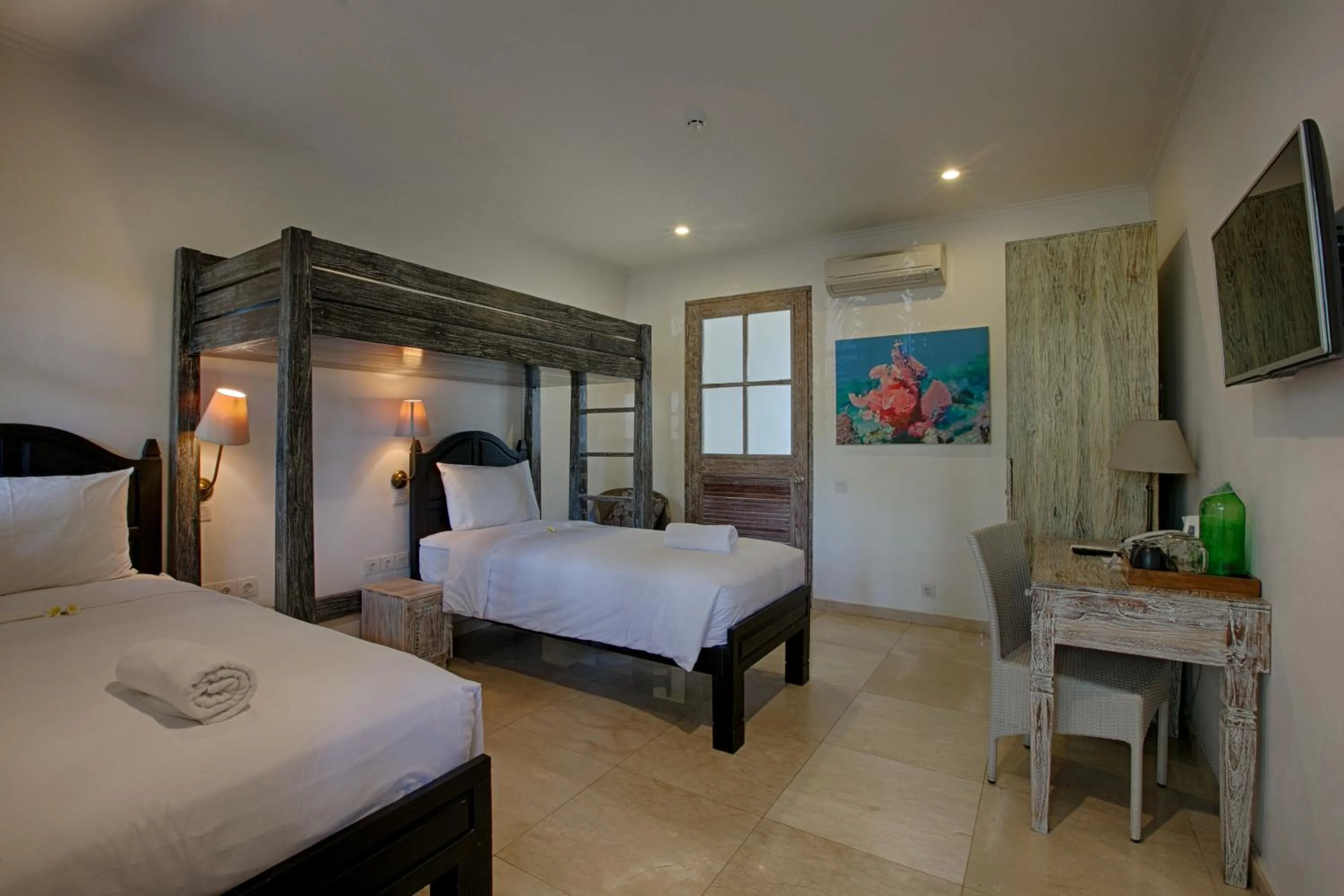 Bed in OK Divers Resort & Spa