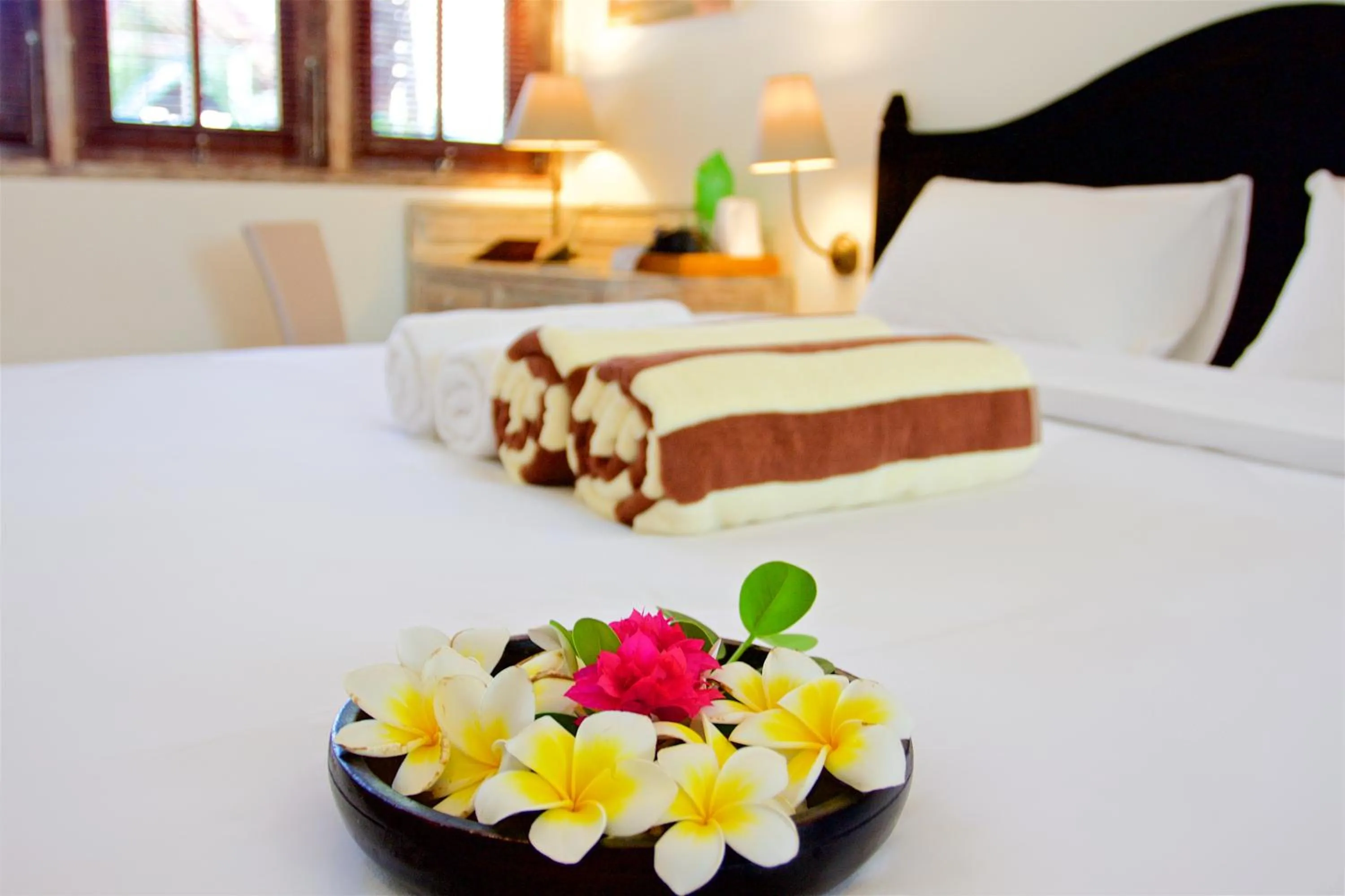 Bed in OK Divers Resort & Spa