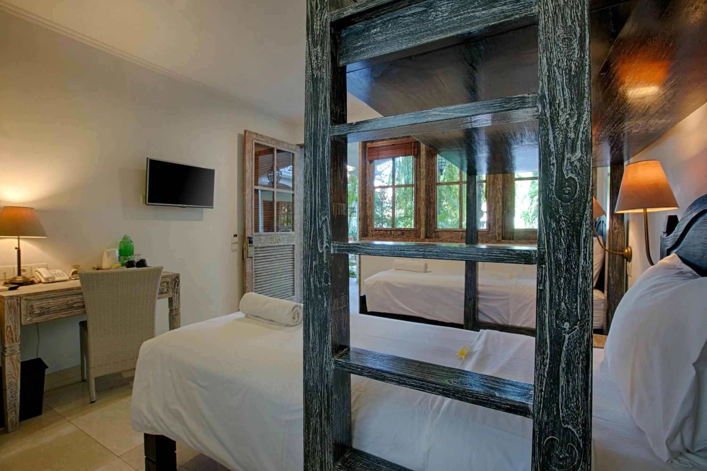 Bed in OK Divers Resort & Spa