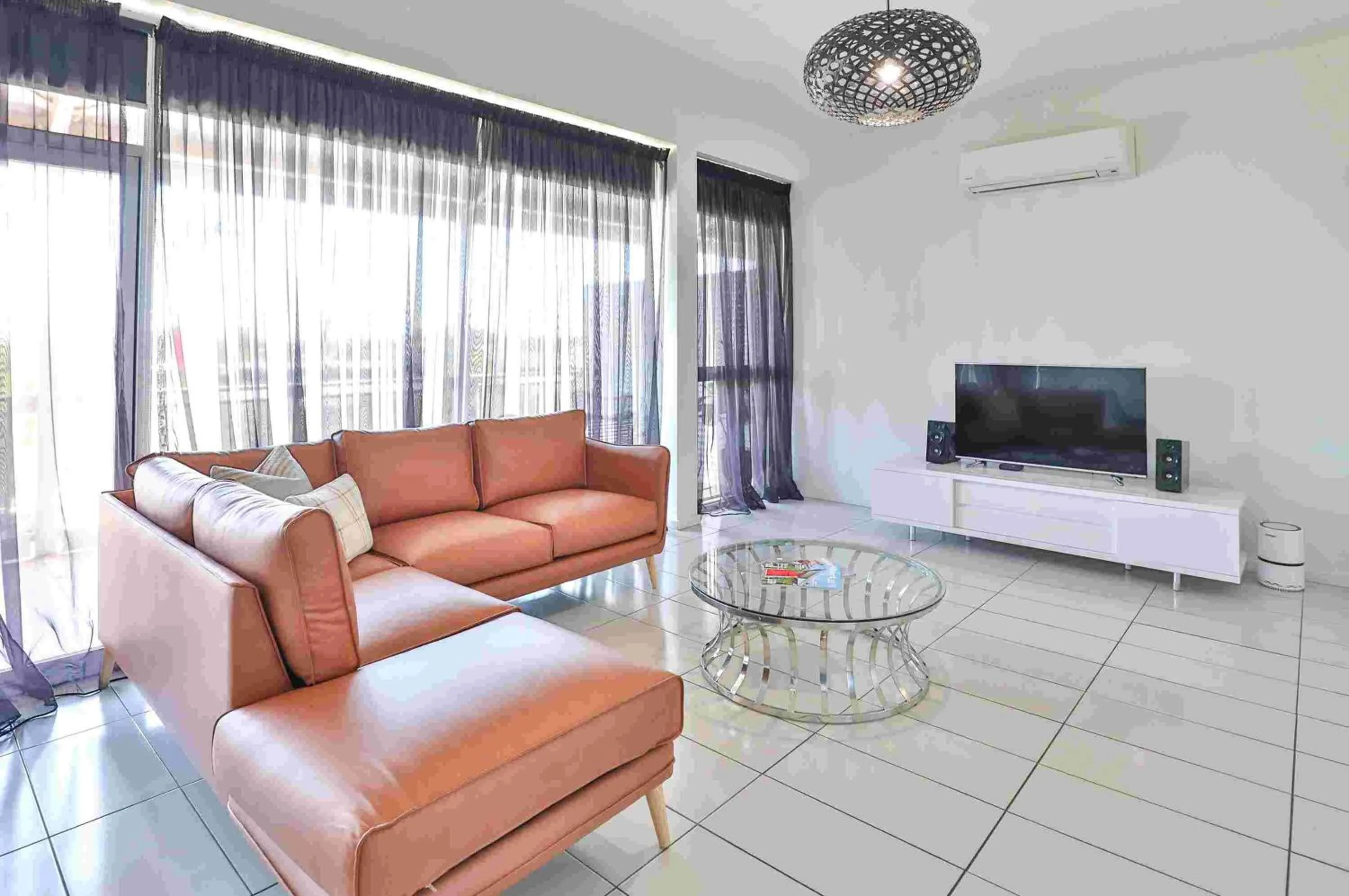 TV and multimedia in Indulge Apartments - CBD