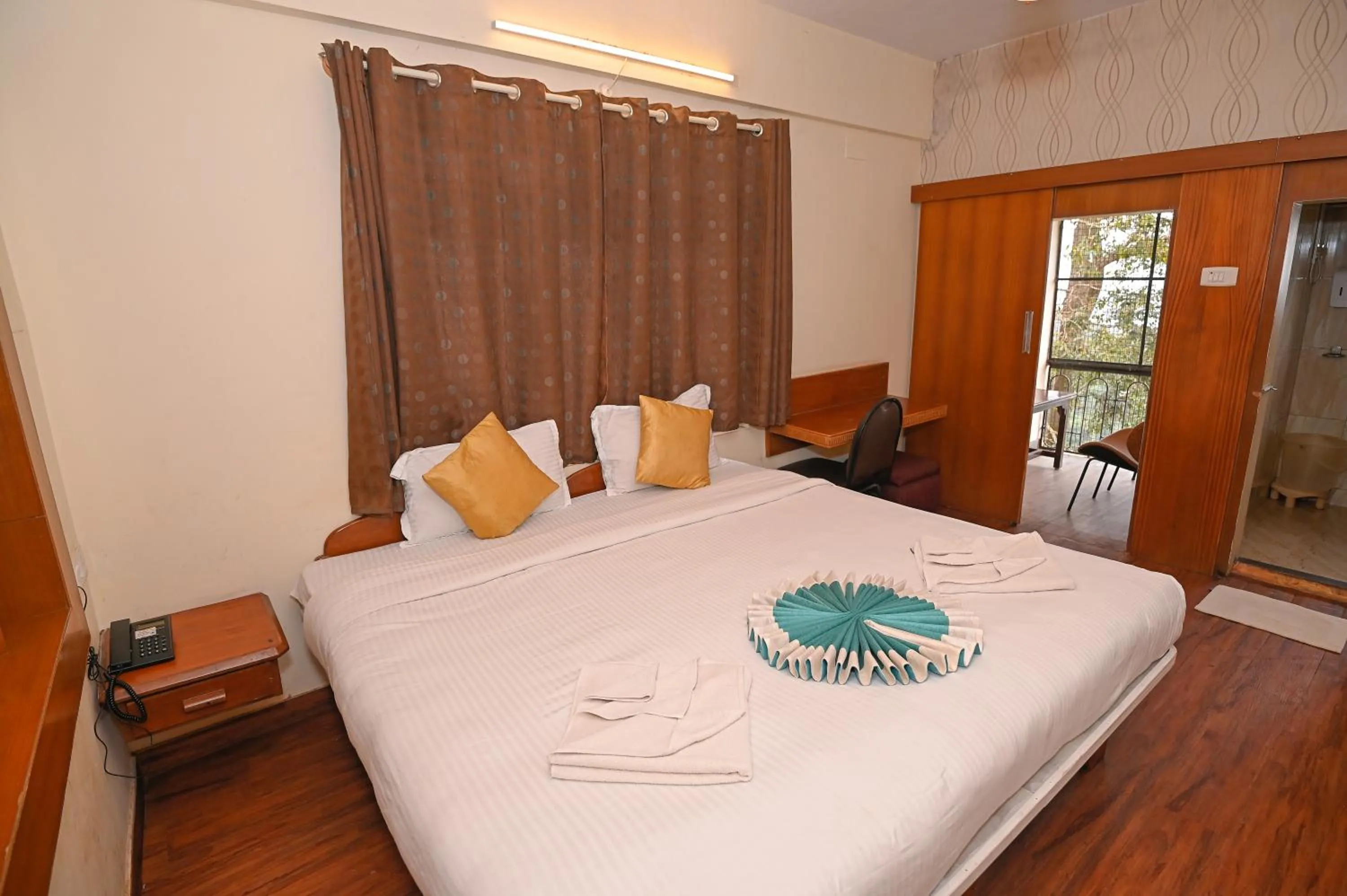 Seating area, Bed in Hotel Vivek