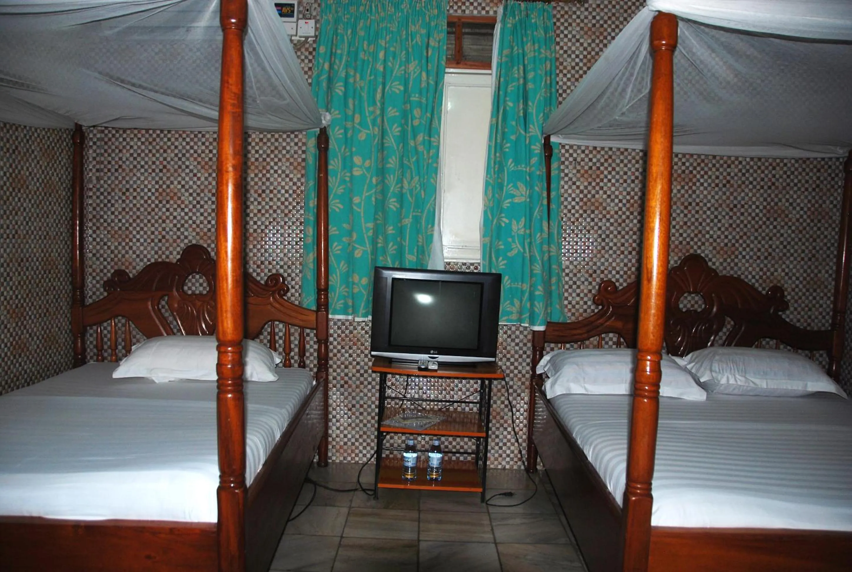 Photo of the whole room, Bed in Sandton Hotel Kasese