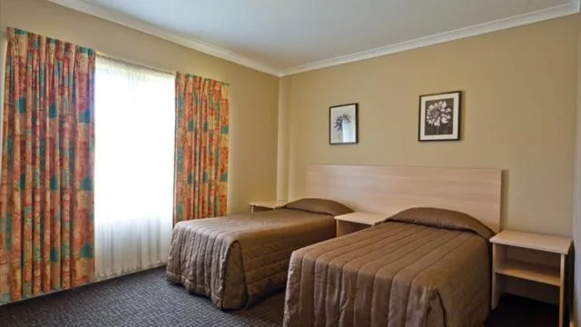 Bed in Motel Le Grande