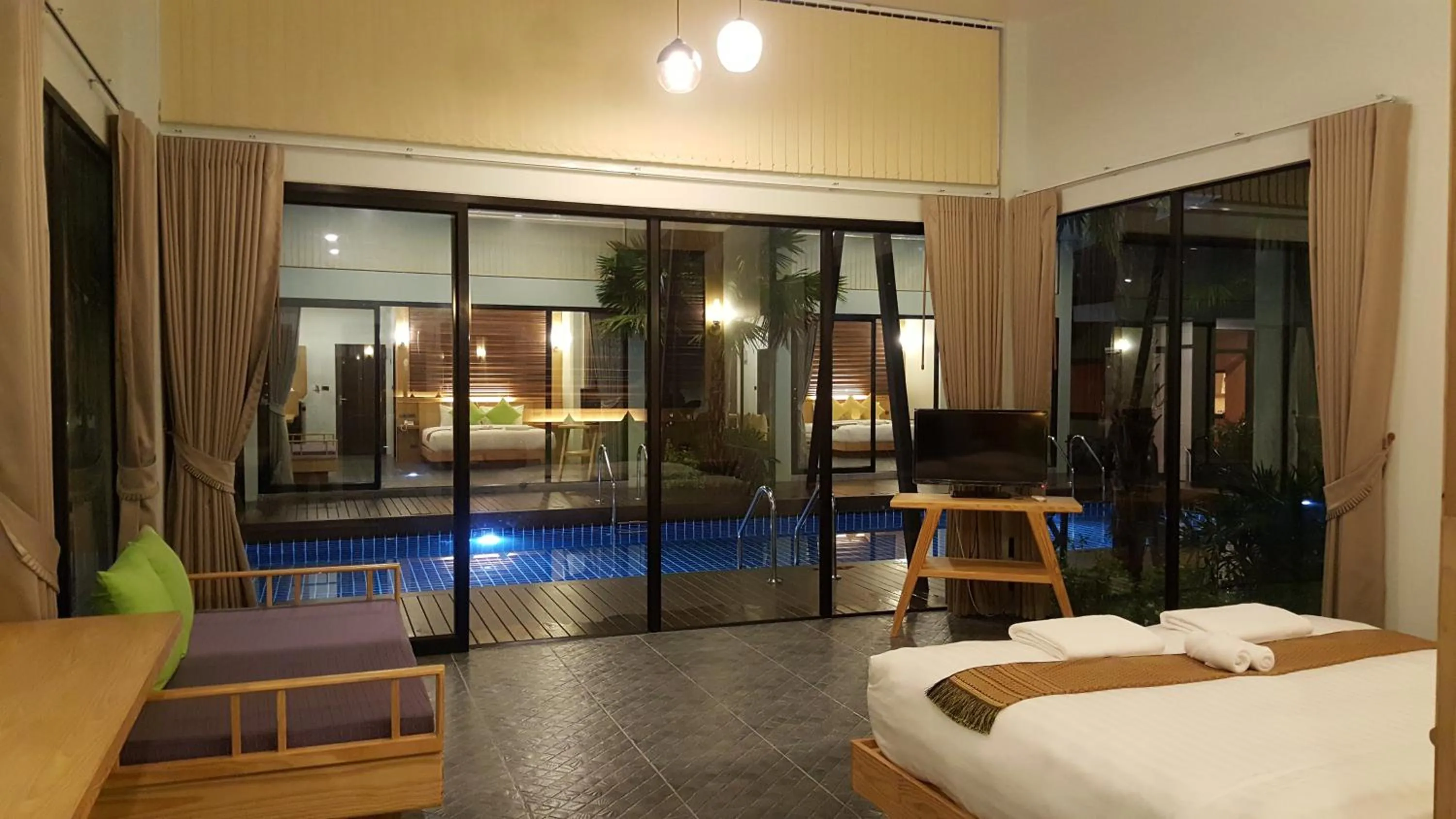 Pool view, Bed in Jasmine Resort And Spa