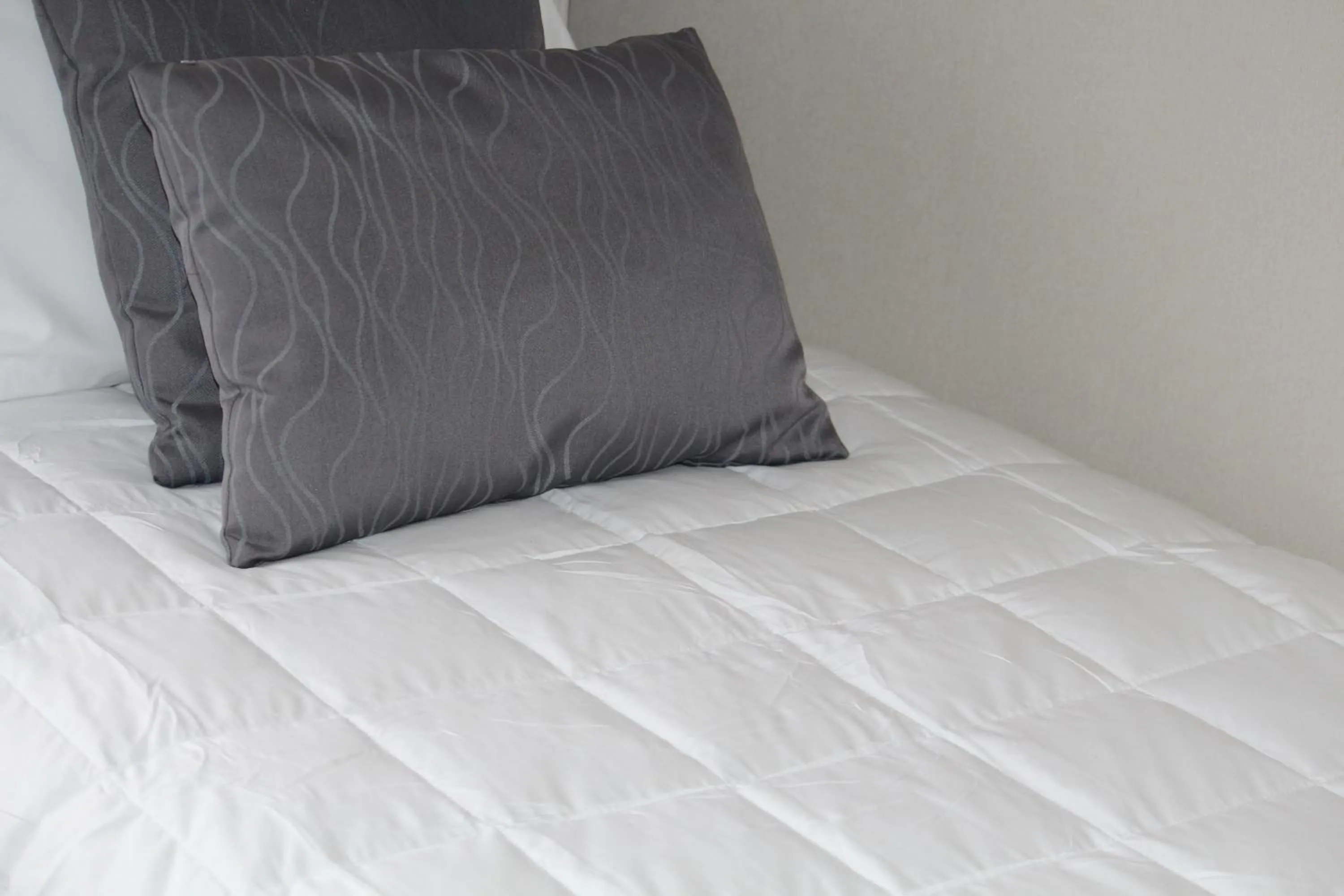 Bed in Coromandel Cottages