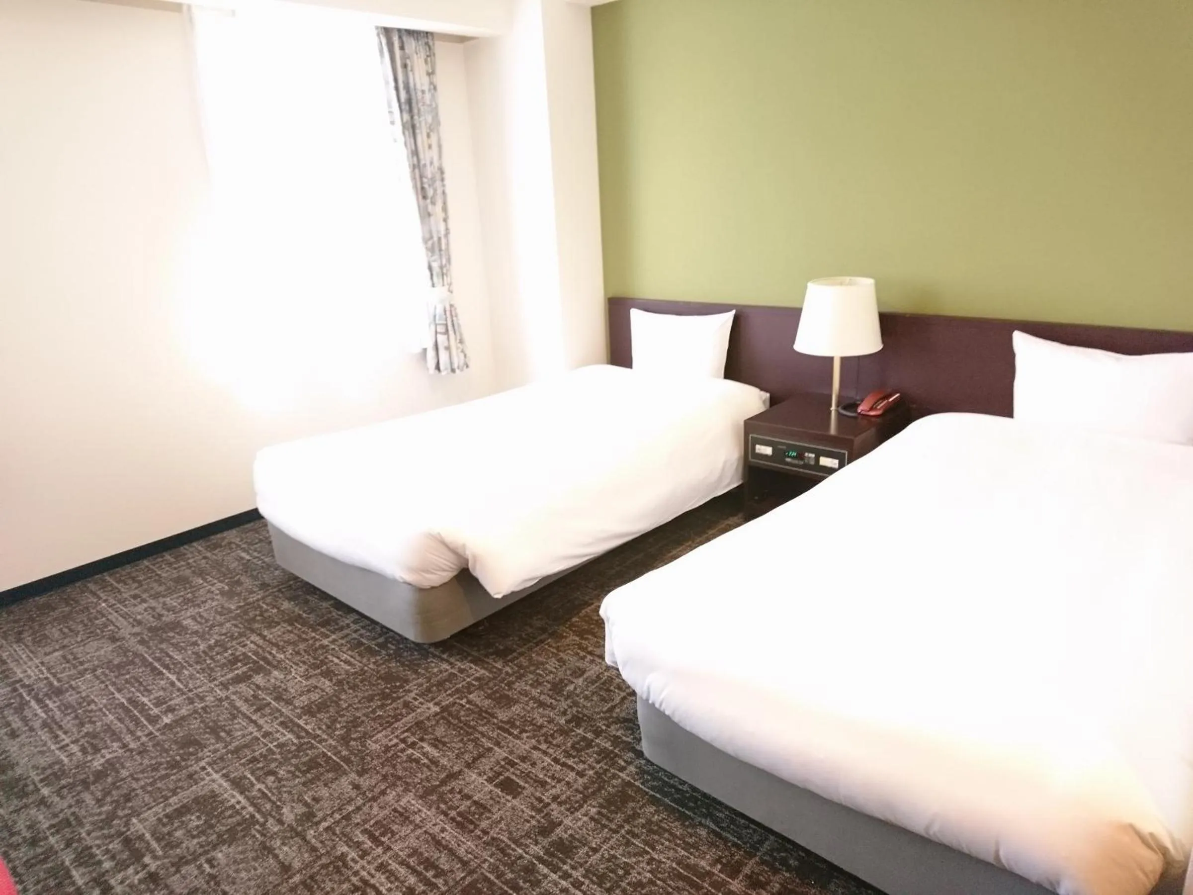 Bed in Hotel Bougain Villea Sapporo