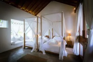 Bed in De Ubud Villas & Spa