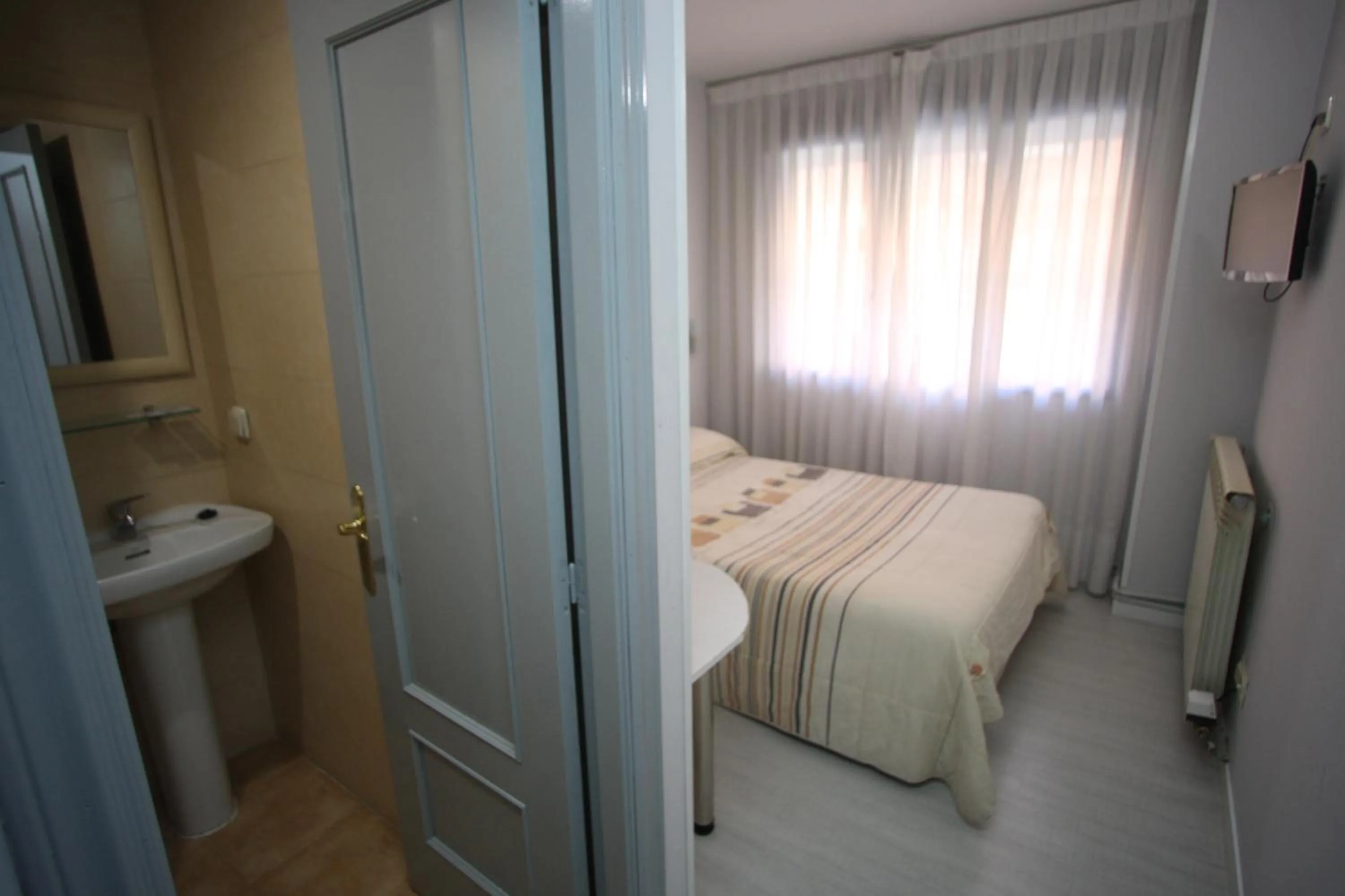 Spring, Bed in Hostal Santa Barbara