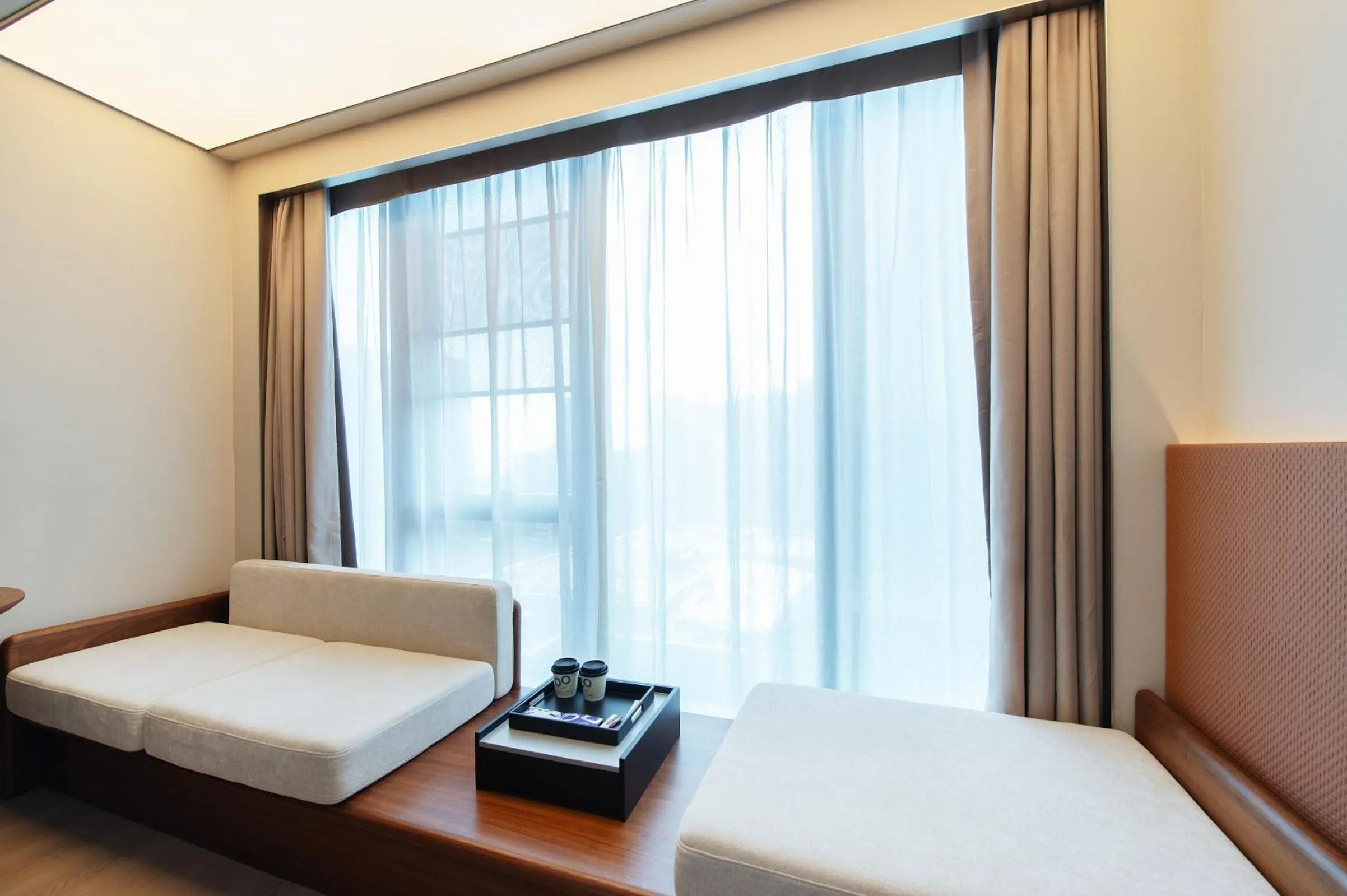 Seating area, Bed in Novotel Xiamen International Convention Center