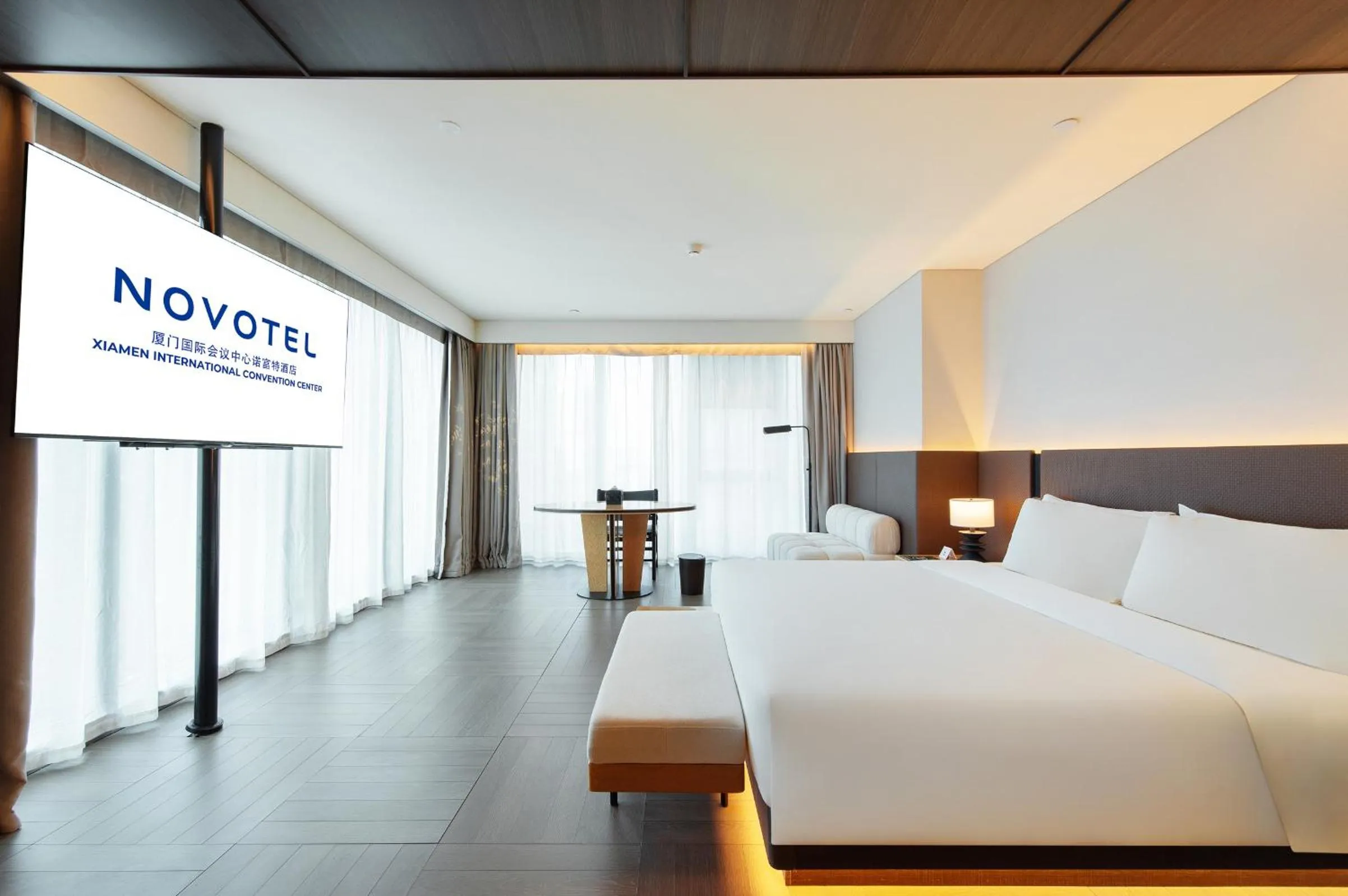 Photo of the whole room, Bed in Novotel Xiamen International Convention Center