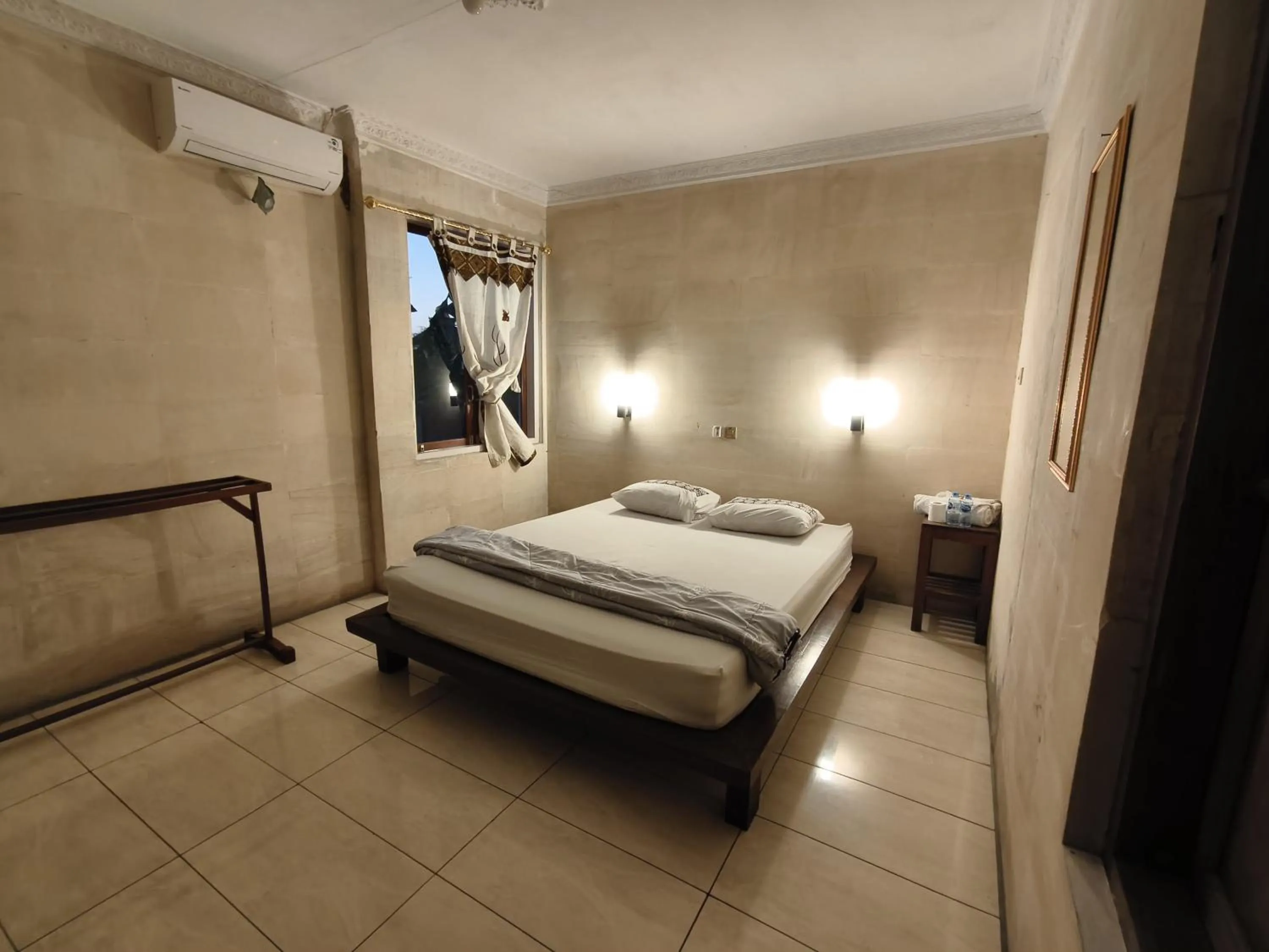 Bed in Lotus 2 Guest House