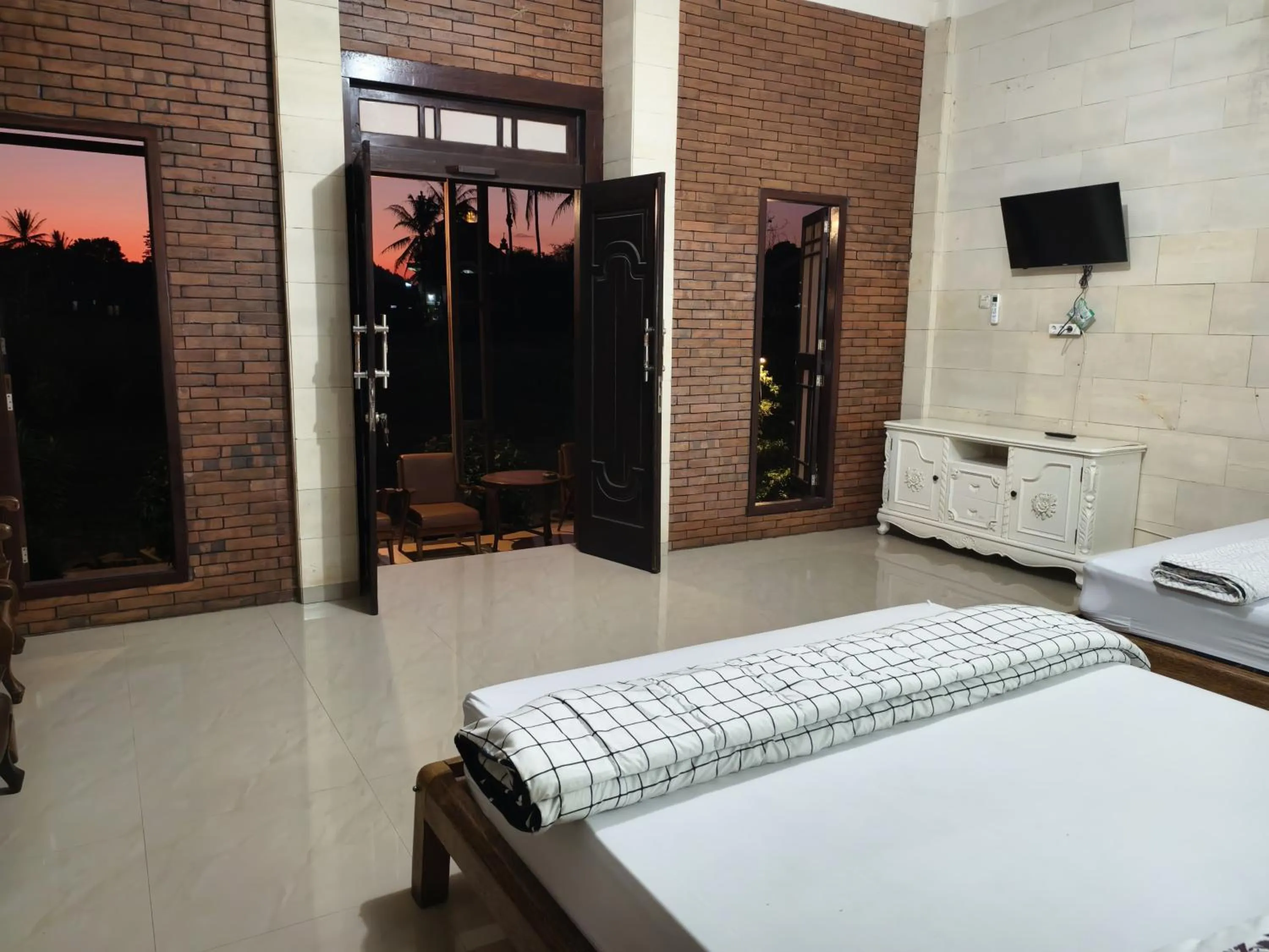 Bed in Lotus 2 Guest House