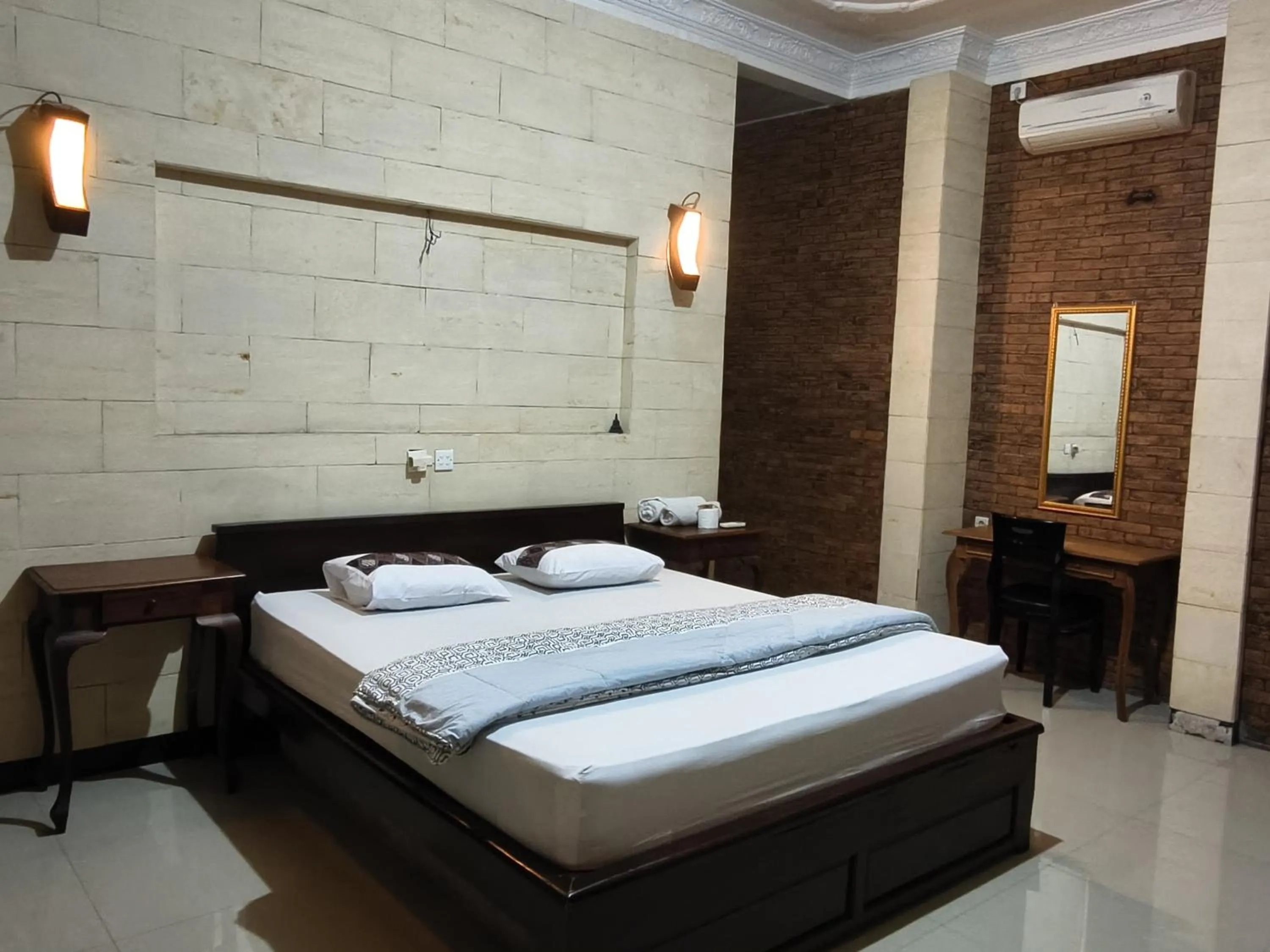 Bed in Lotus 2 Guest House