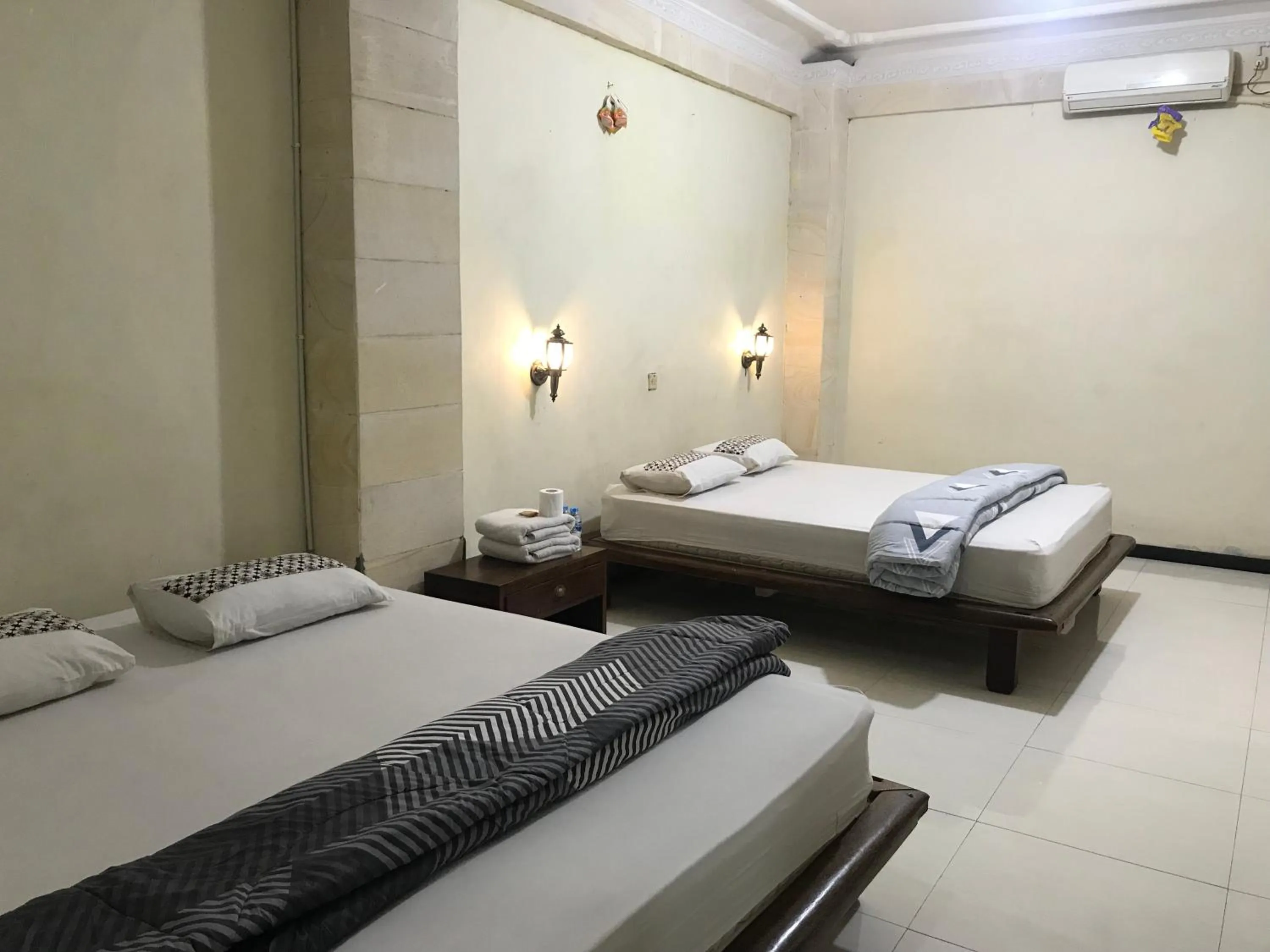 Bed in Lotus 2 Guest House