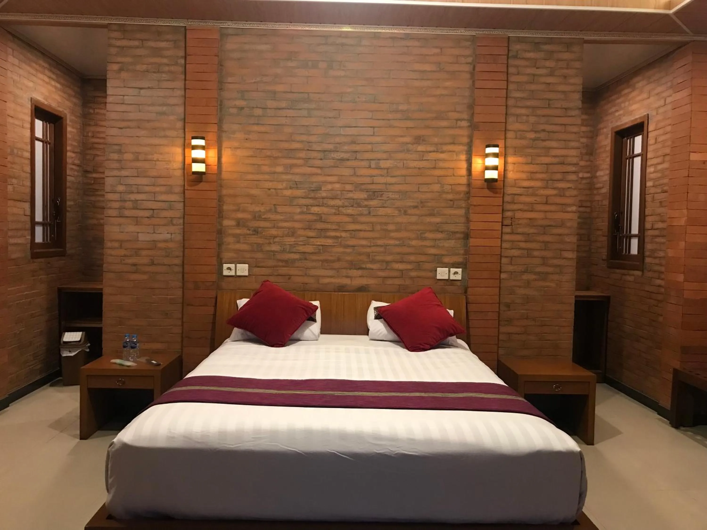 Bed in Lotus 2 Guest House