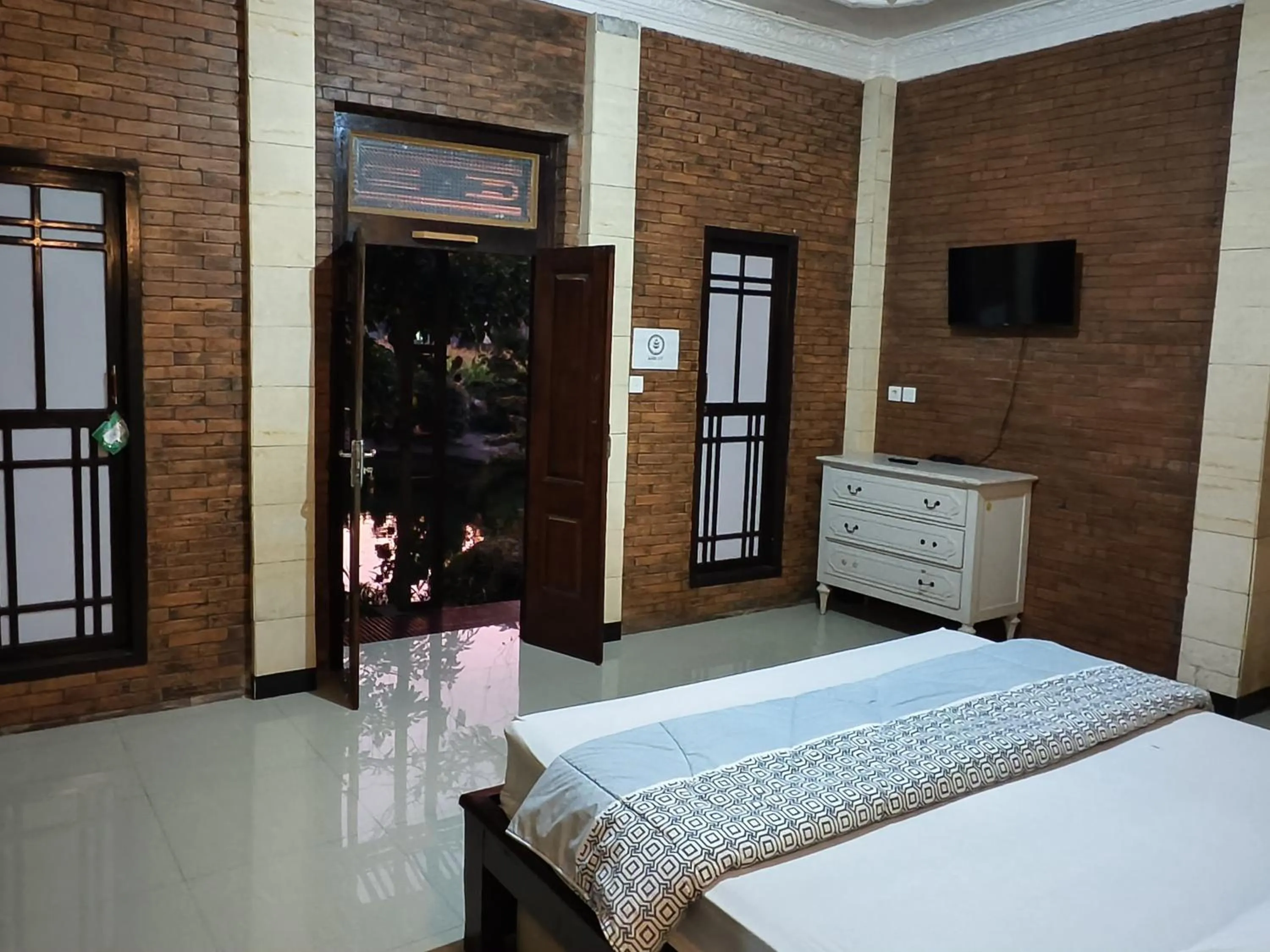 Bed in Lotus 2 Guest House