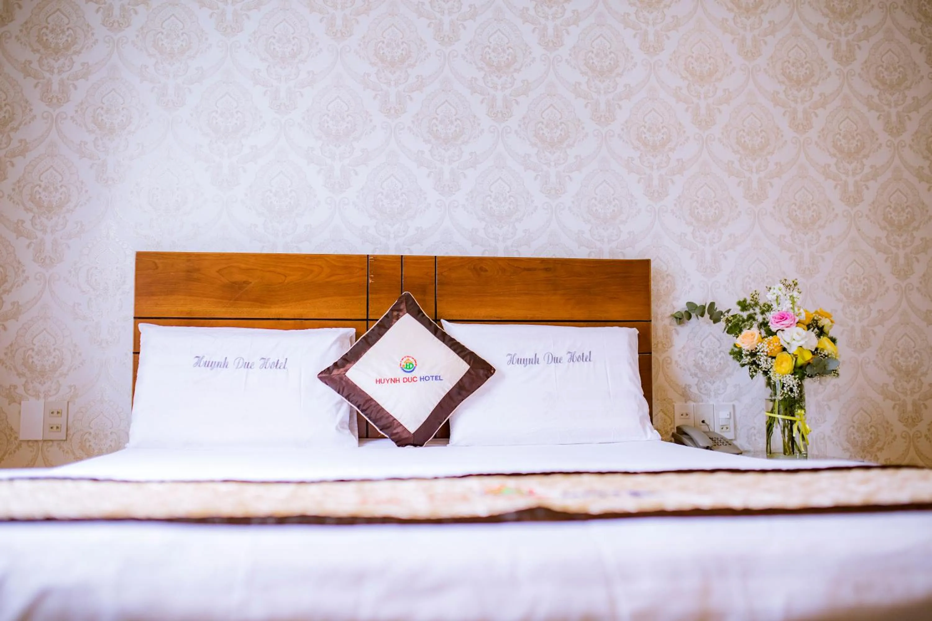 Bed in Huynh Duc Hotel