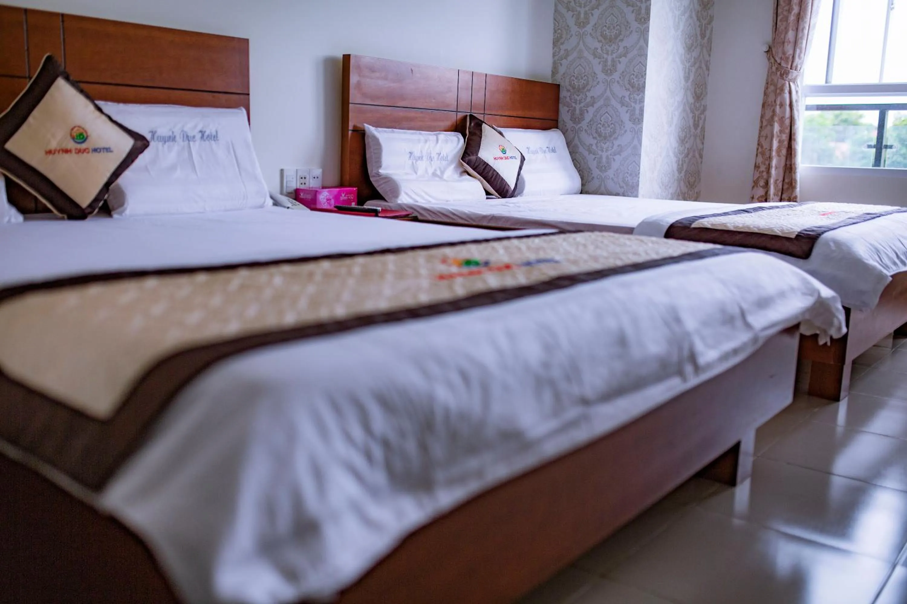 Bed in Huynh Duc Hotel