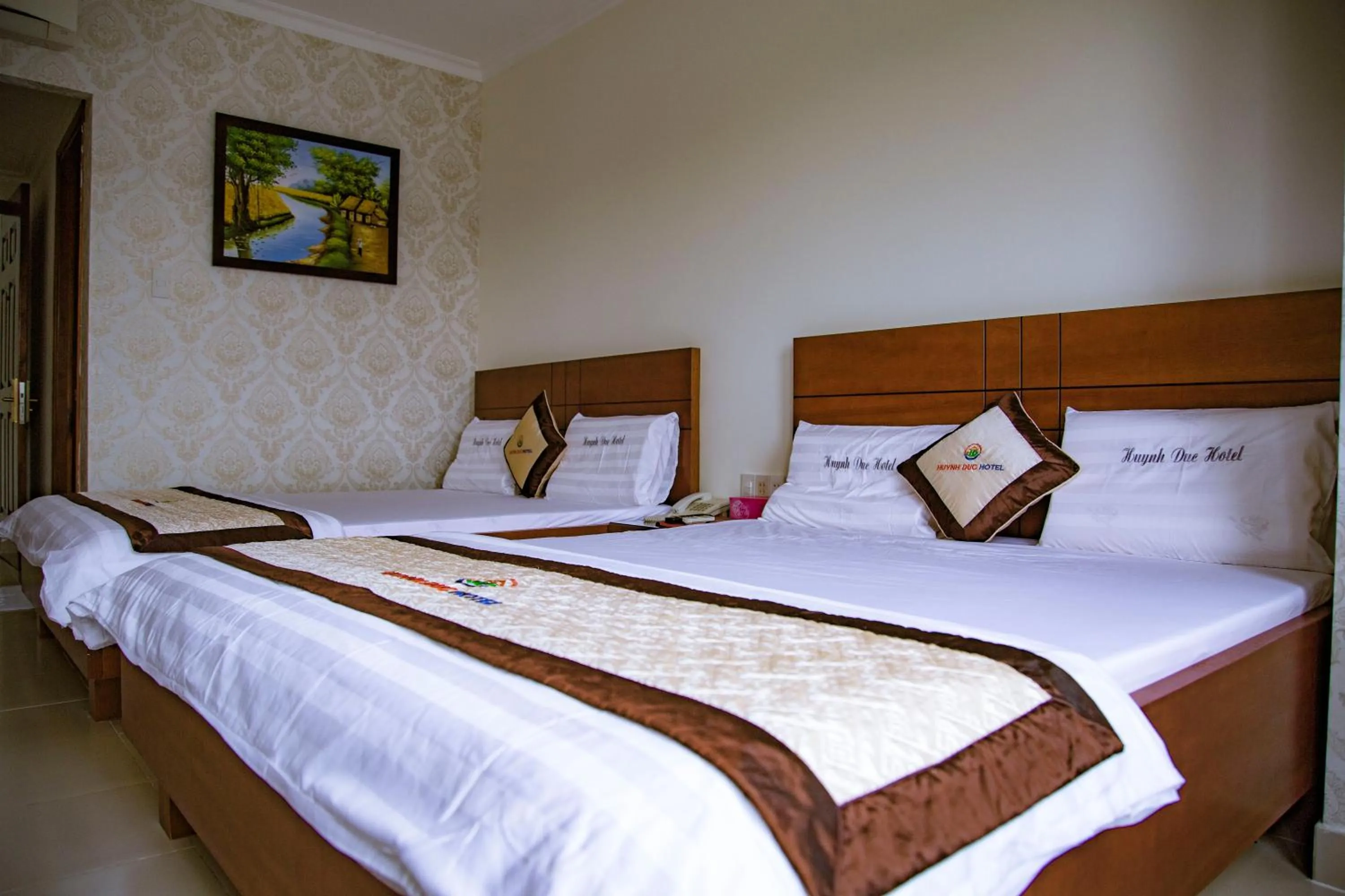 Bed in Huynh Duc Hotel