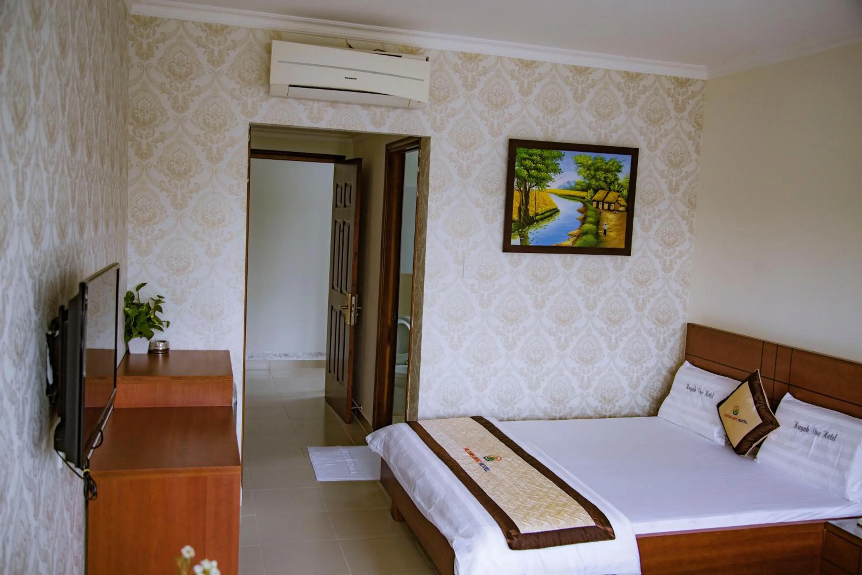 Bed in Huynh Duc Hotel