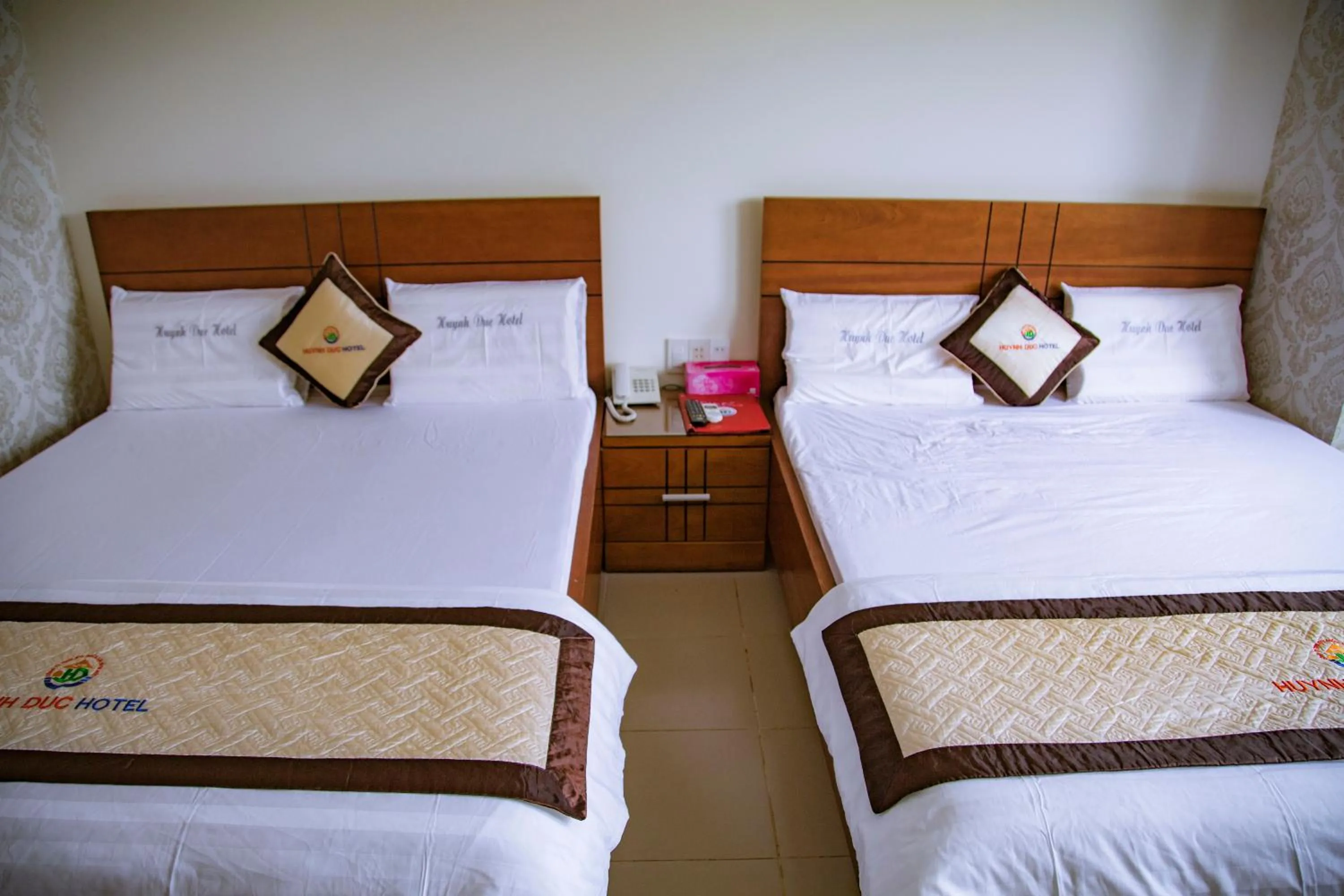 Bed in Huynh Duc Hotel