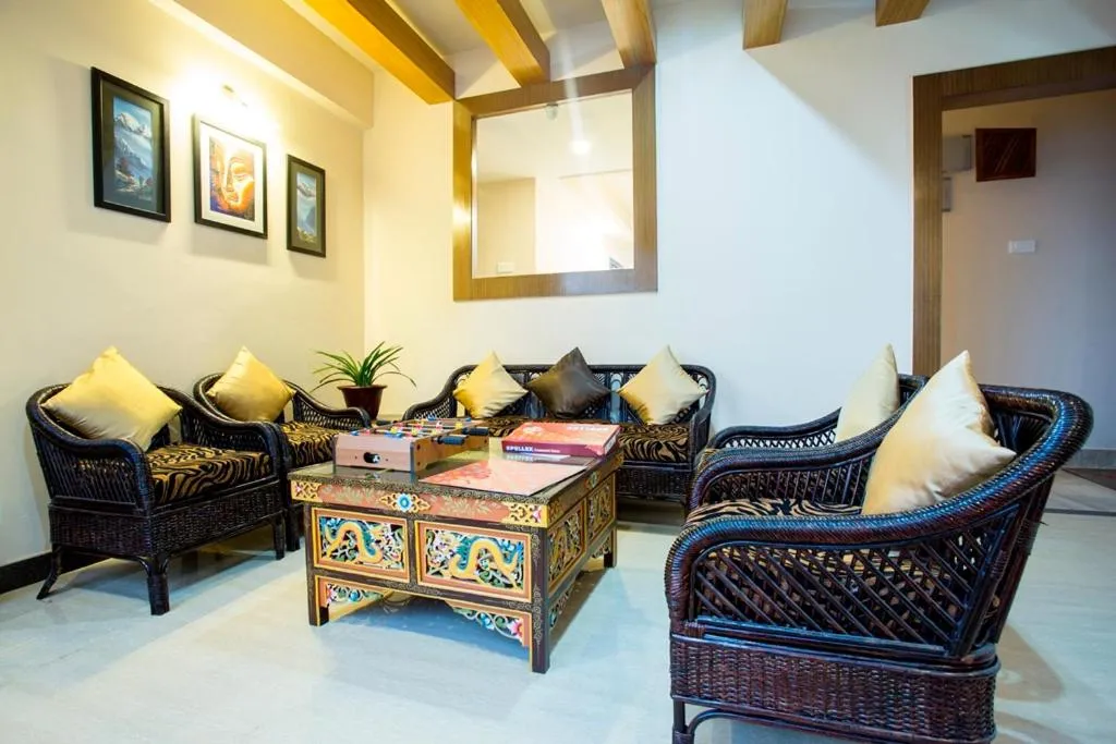 Communal lounge/ TV room in New Orchid Lords Inn Gangtok