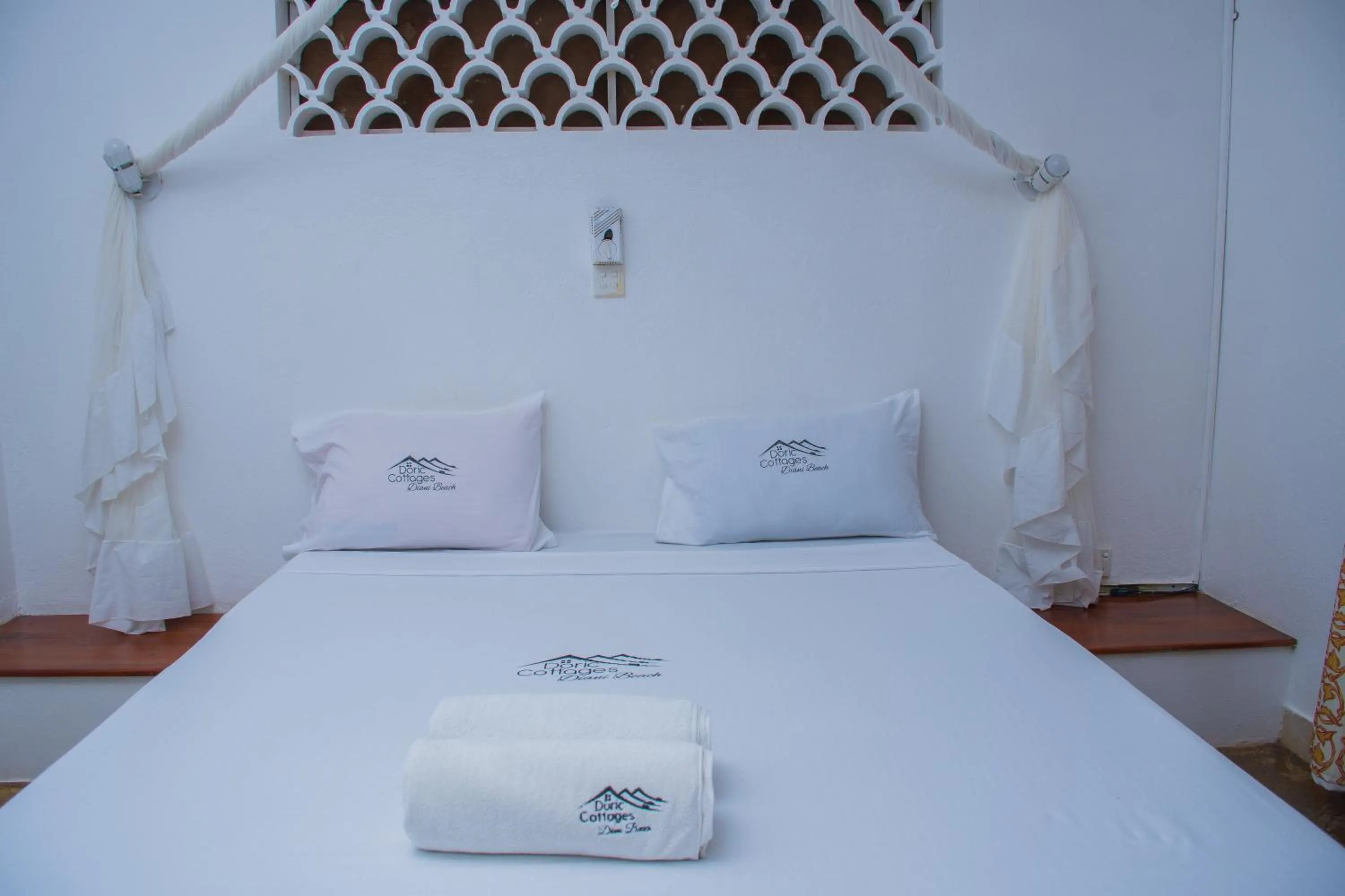 Bed in Doric Cottages Diani