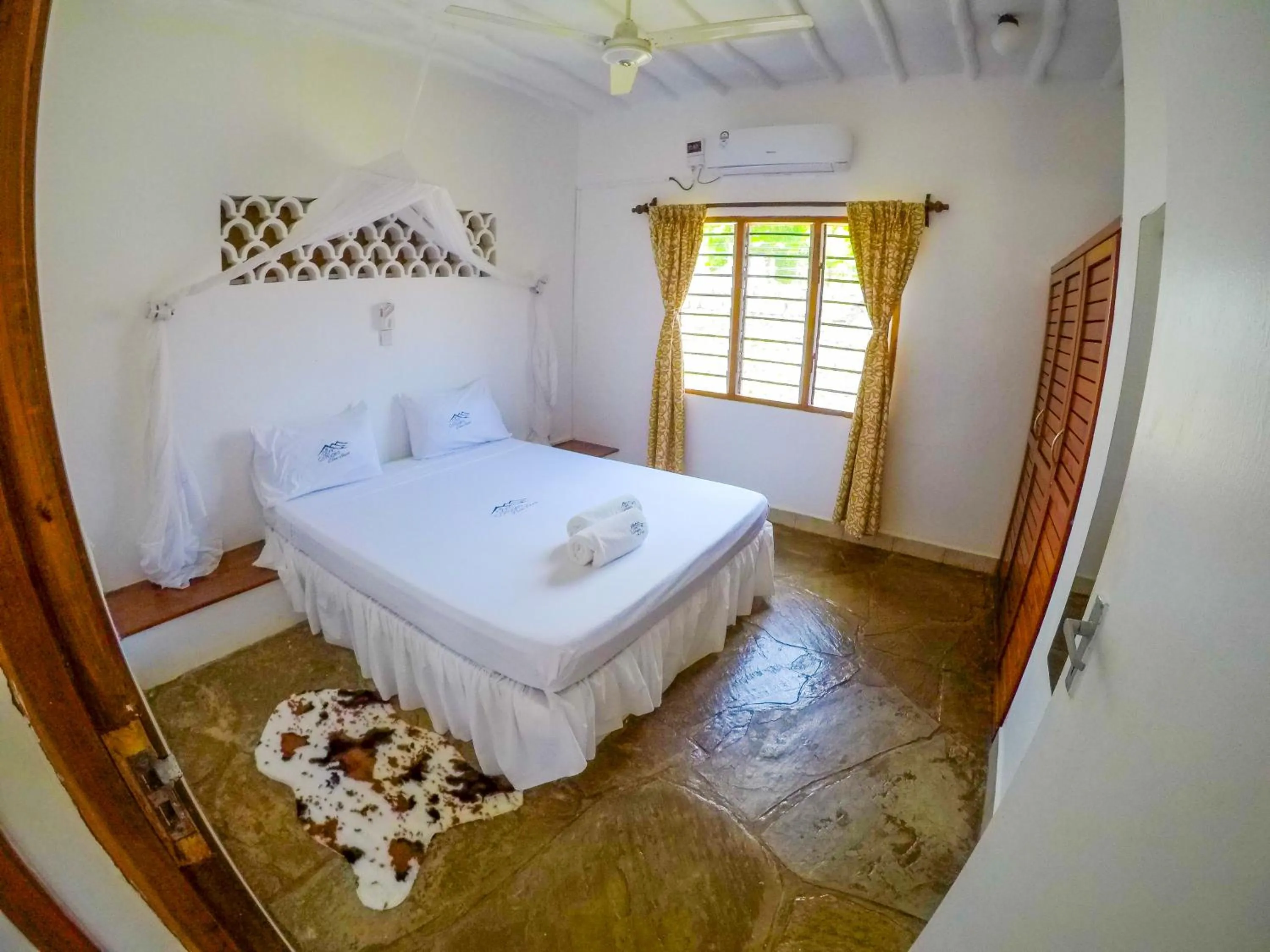 Bed in Doric Cottages Diani