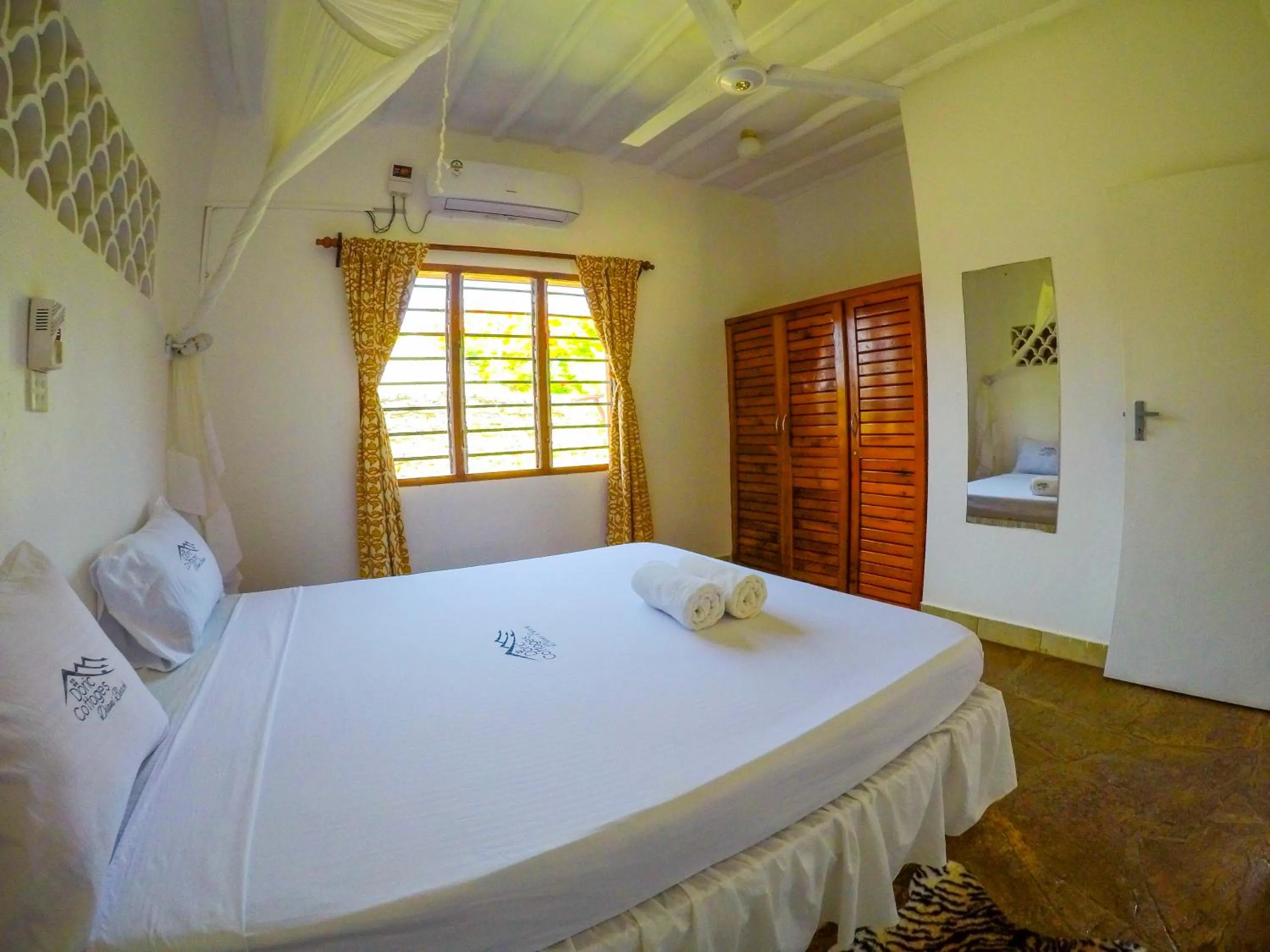 Bed in Doric Cottages Diani