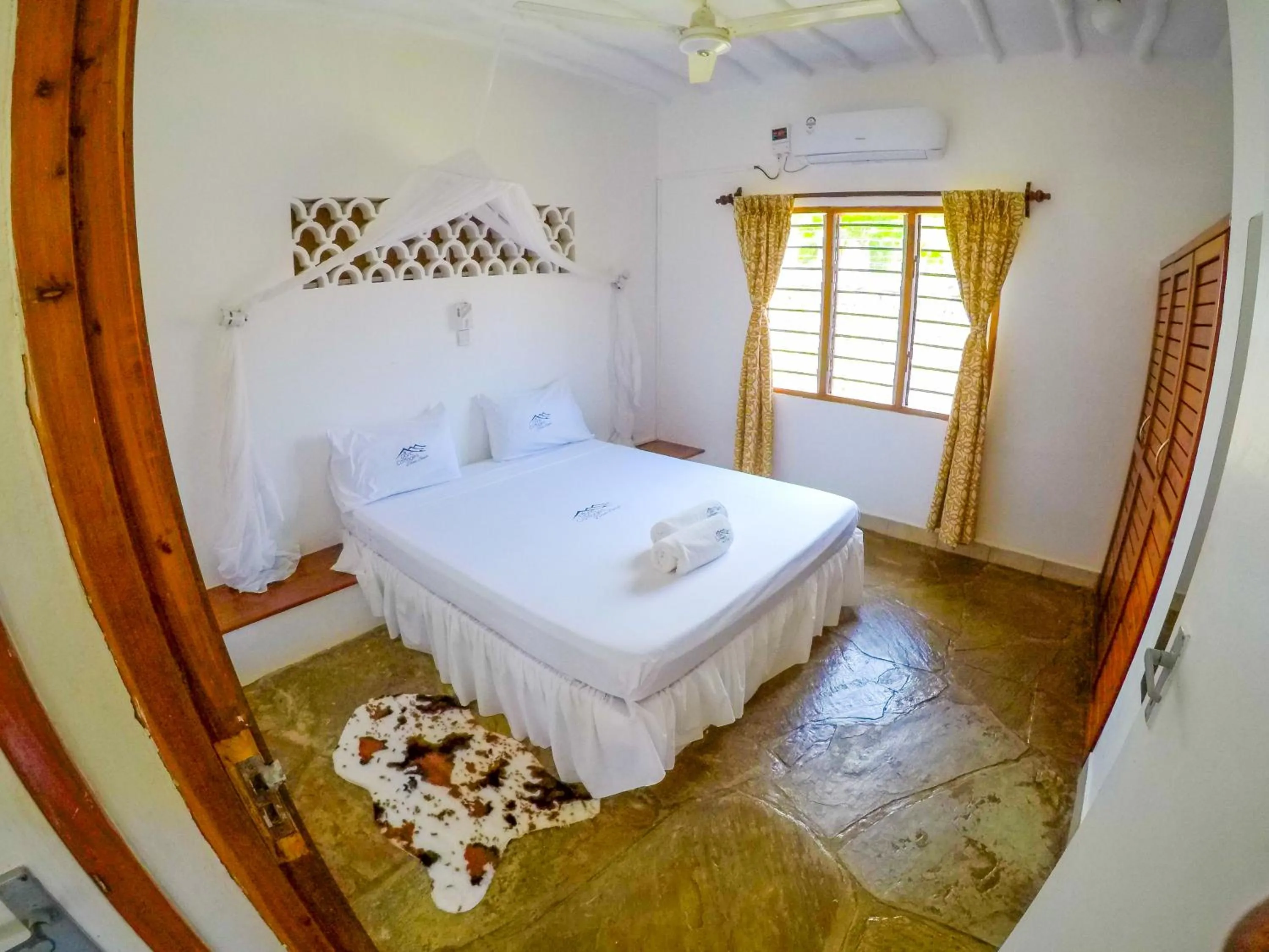 Bed in Doric Cottages Diani