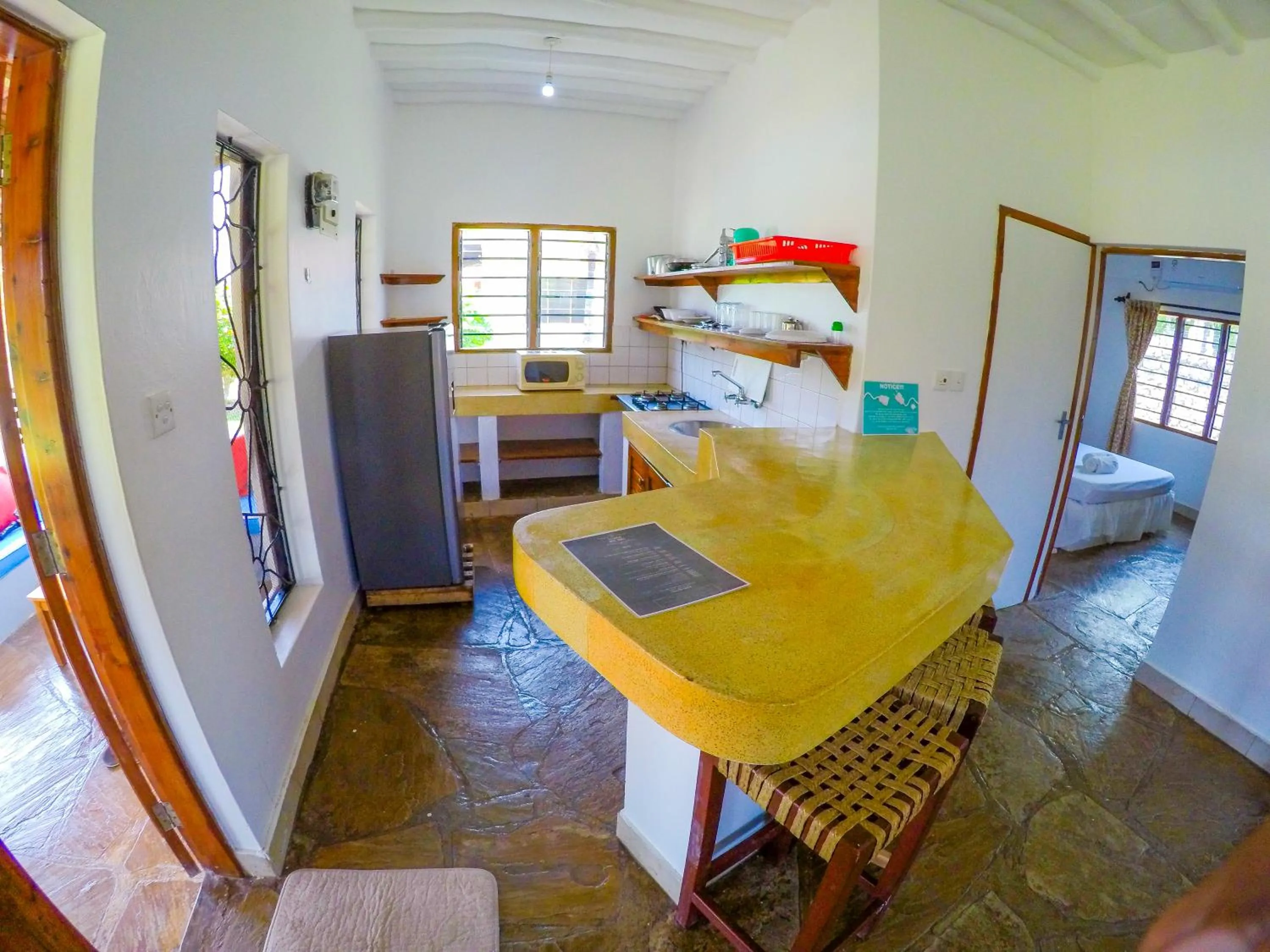 Dining area, Bed in Doric Cottages Diani