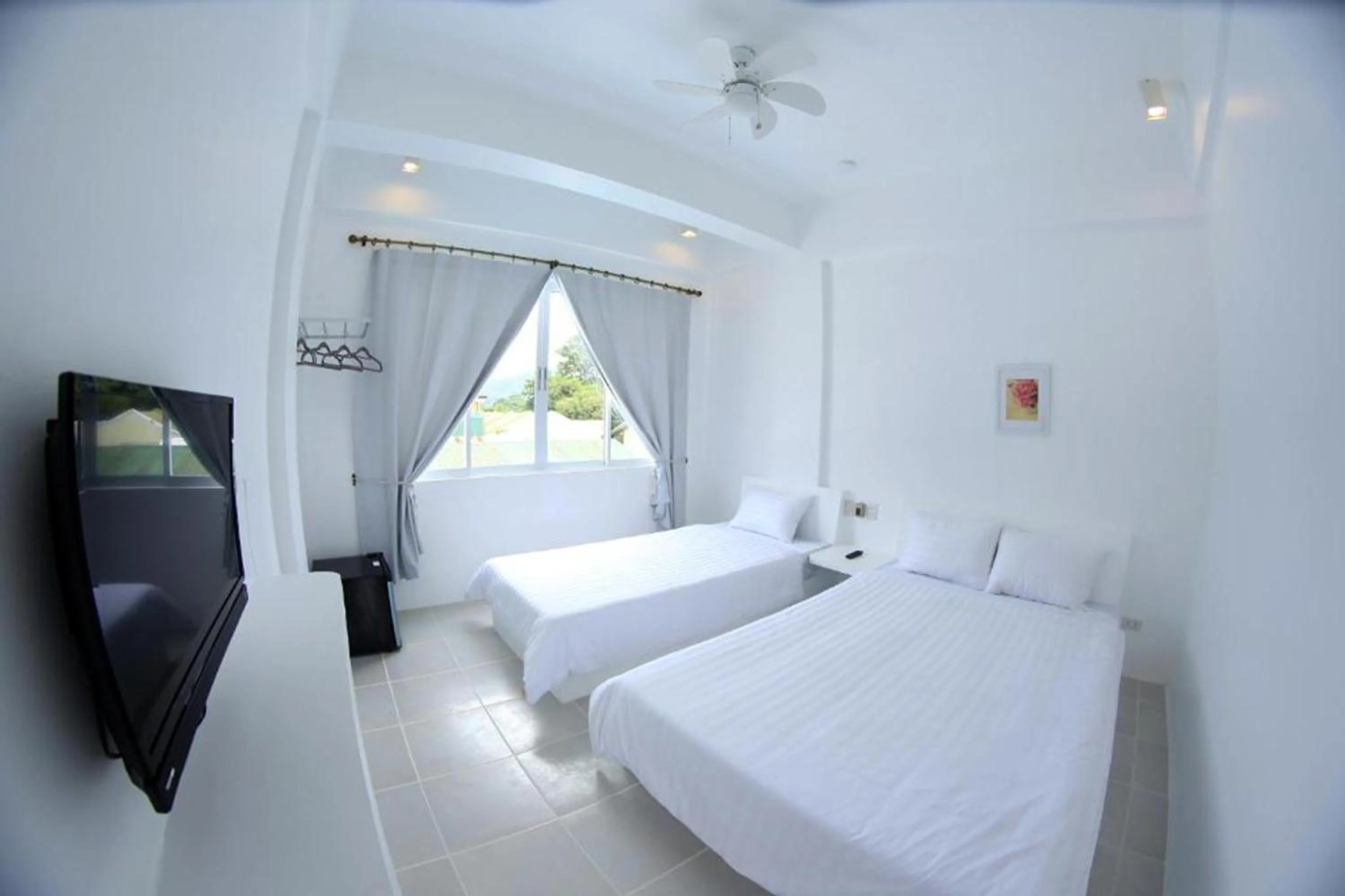 Photo of the whole room, Bed in Coron Bluewave Hotel