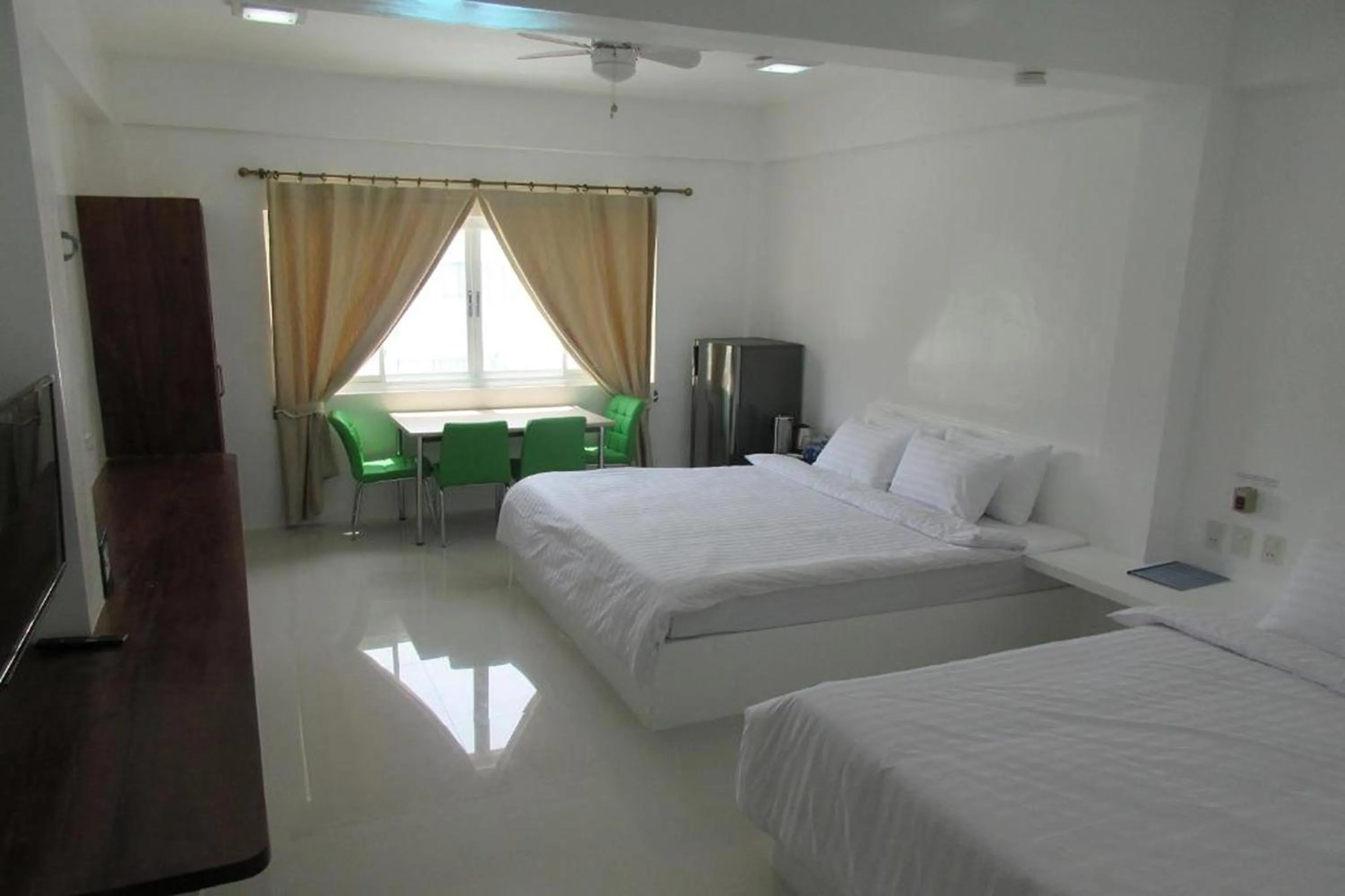 Photo of the whole room, Bed in Coron Bluewave Hotel