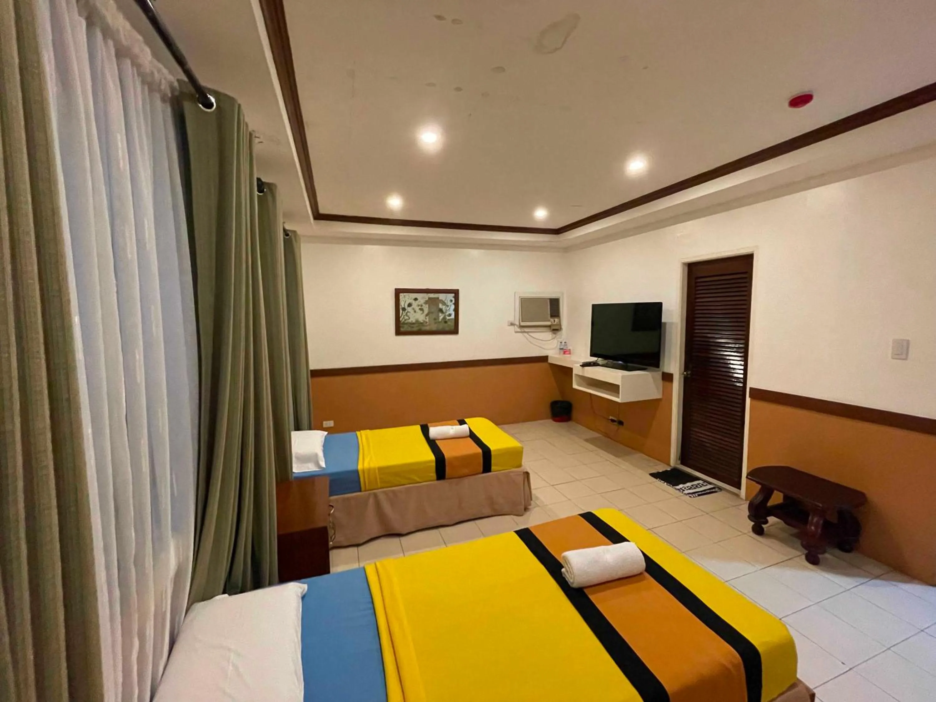 Bed in Palette Gems Hotel and Conference Center