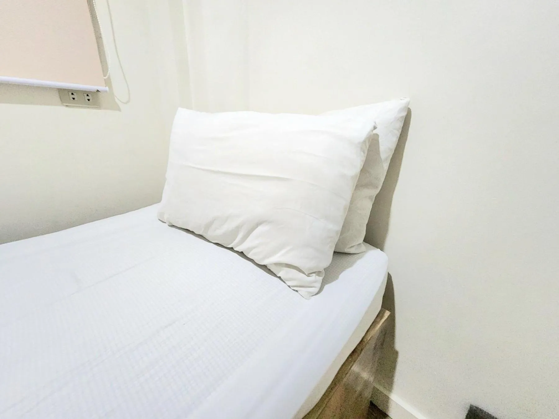 Bed in Stone House Hotel Manila