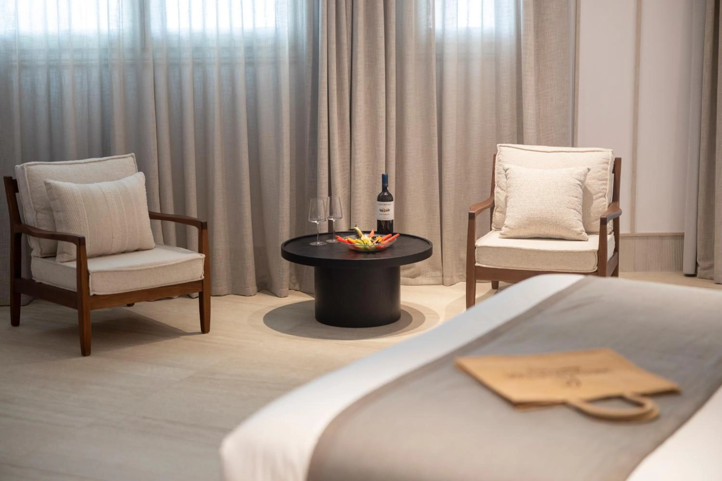 Seating area, Bed in Santo Pure Oia Suites & Villas