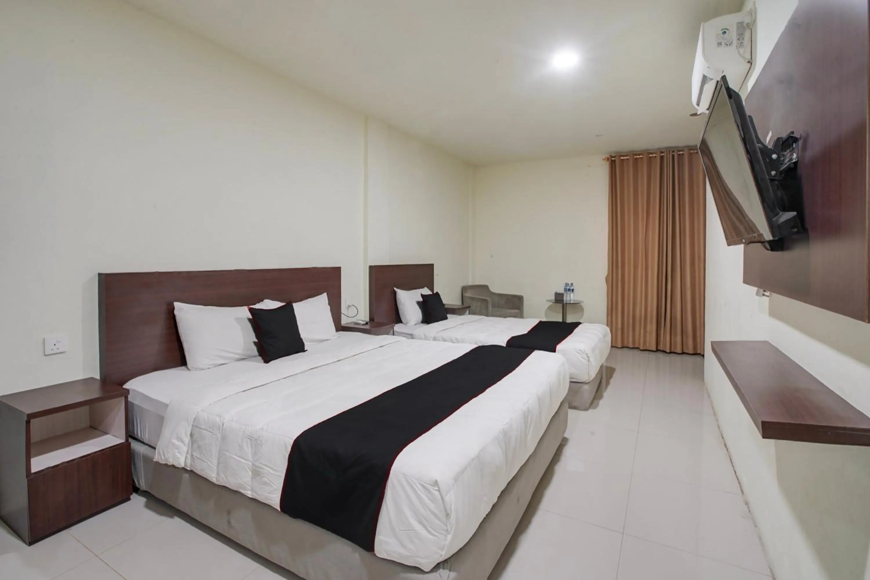 Family Suite in Collection O near Harbour Bay Mall formerly Kansa Hotel