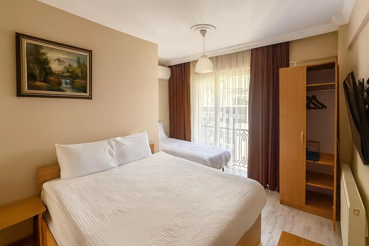 Bed in Lion Stone Hotel