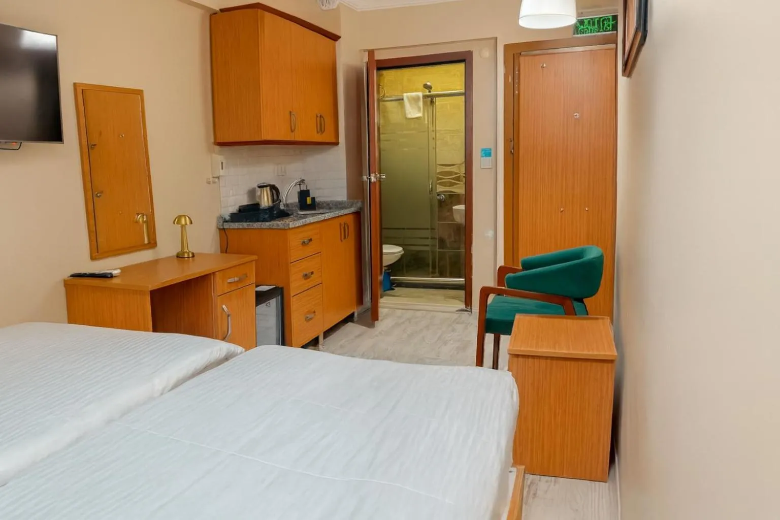 Bed in Lion Stone Hotel