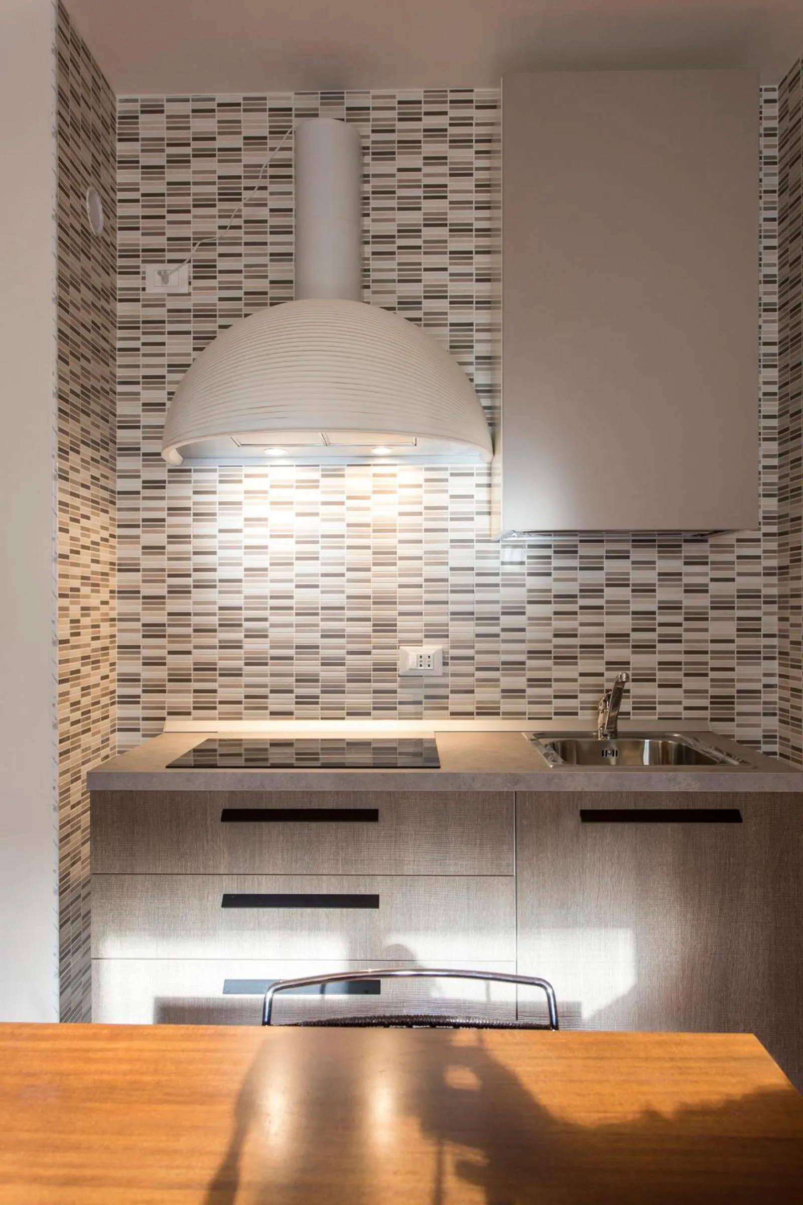 Kitchen or kitchenette in Residenza Ariosto Depandance by Studio Vita