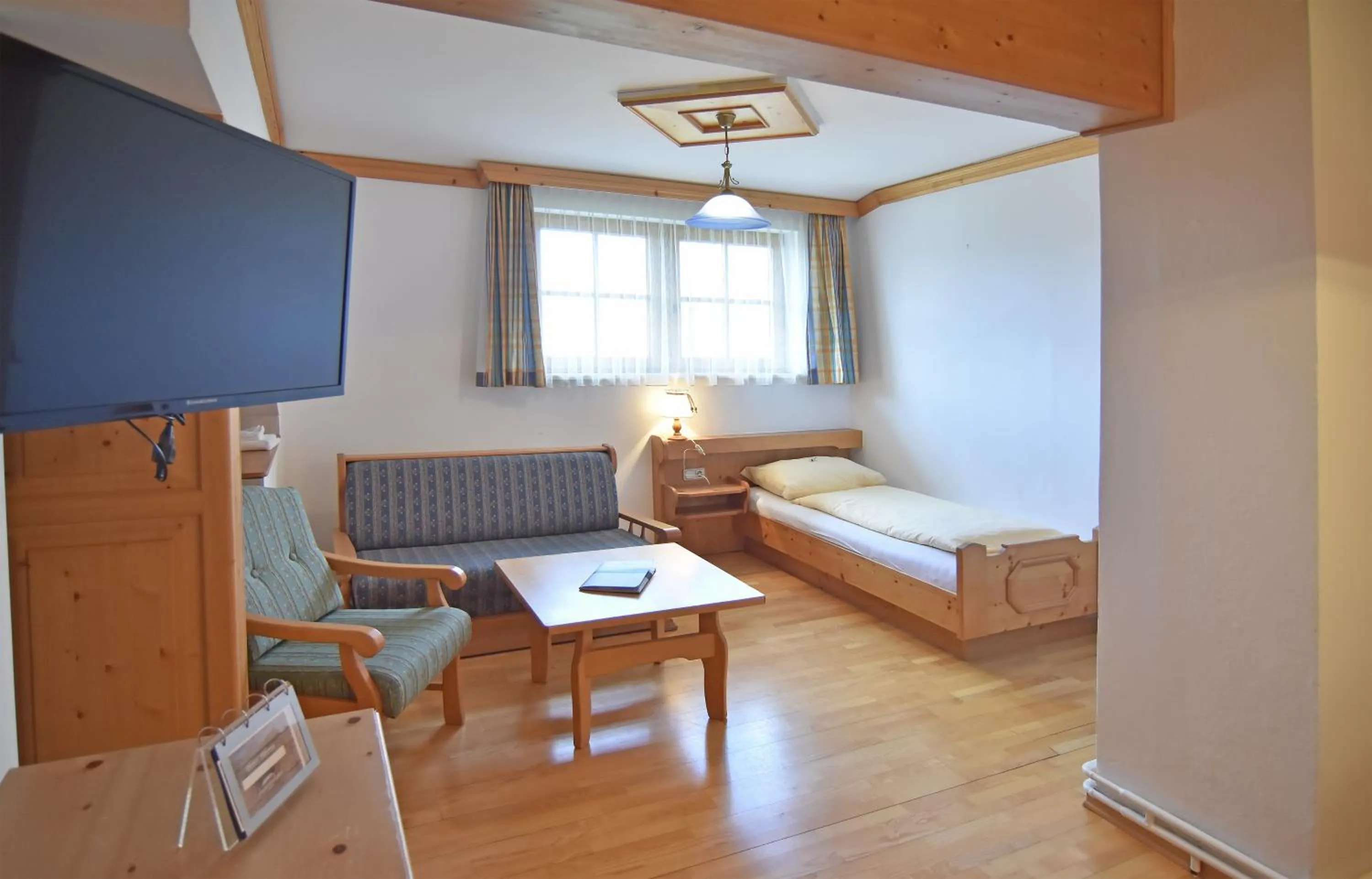 Seating area, Bed in Hotel Ausseerland