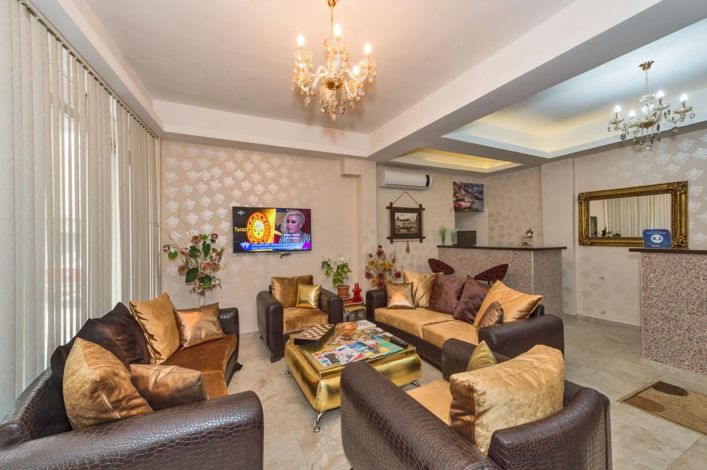 Communal lounge/ TV room in Orange Airport Hotel