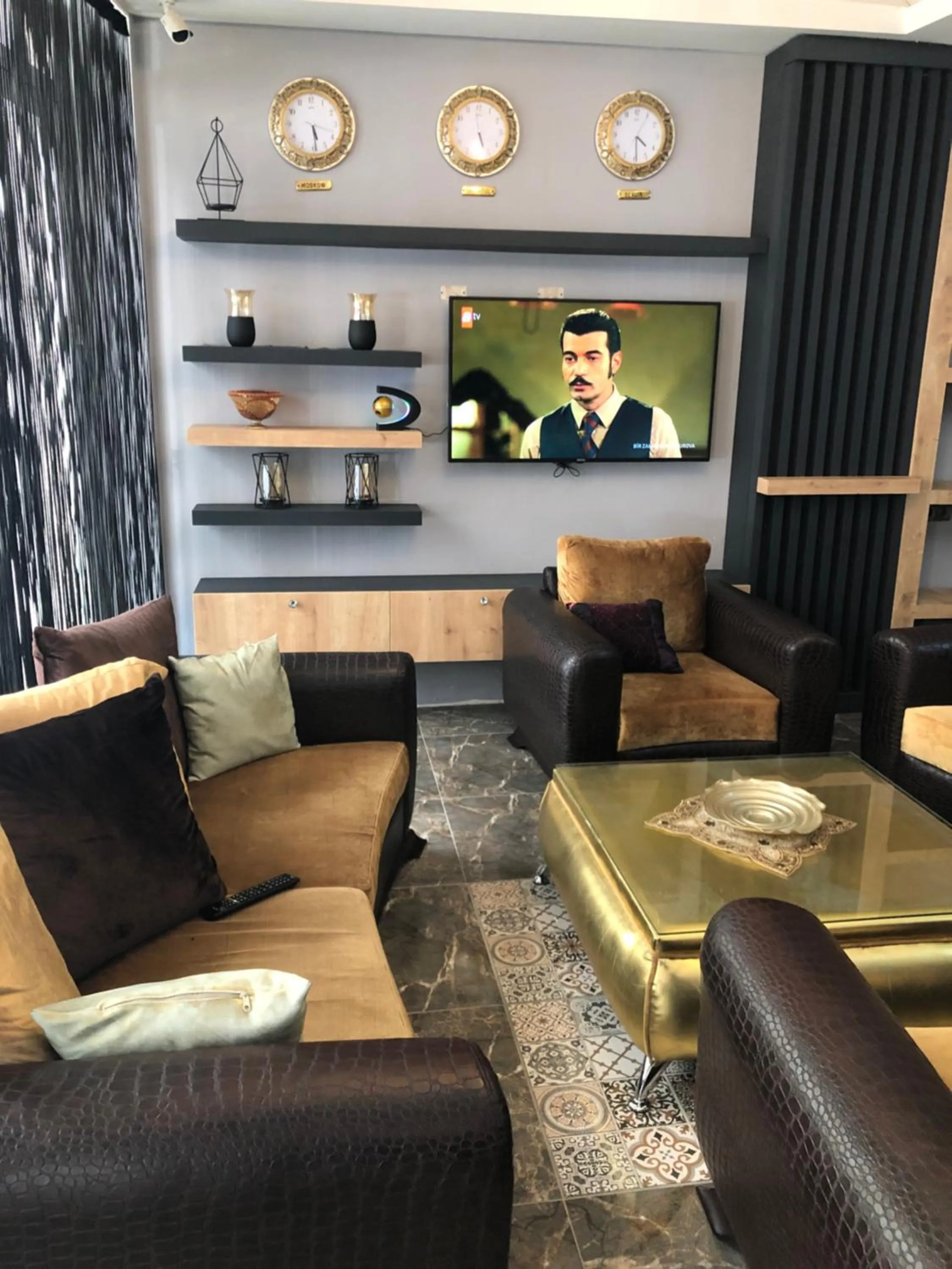 Communal lounge/ TV room in Orange Airport Hotel