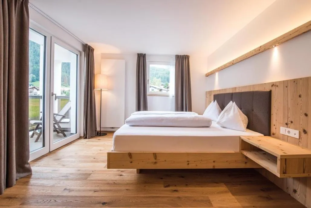 Bed in Hotel Fronza - your ski & mountain home