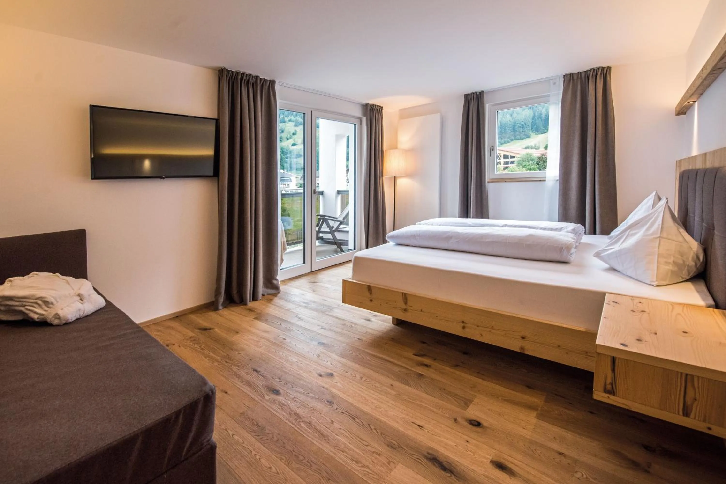 Bed in Hotel Fronza - your ski & mountain home