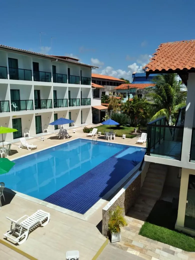 Swimming pool in Pousada Sky Beach Flat